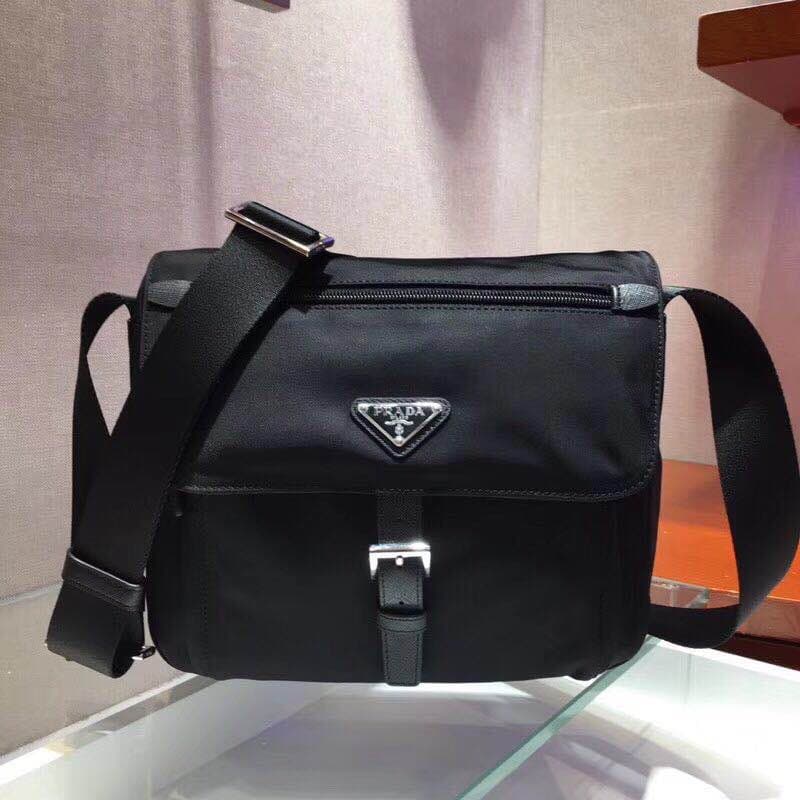 C6964 🆕🆕 Popular 1BD994 product – original style! 🤙🤙 Made with imported nylon material and Saffiano leather trim. Adjustable fabric straps, stainless steel accessories, triangular enamel logos on the sides. Zipper and buckle closure. Two outer pockets; on — image 2