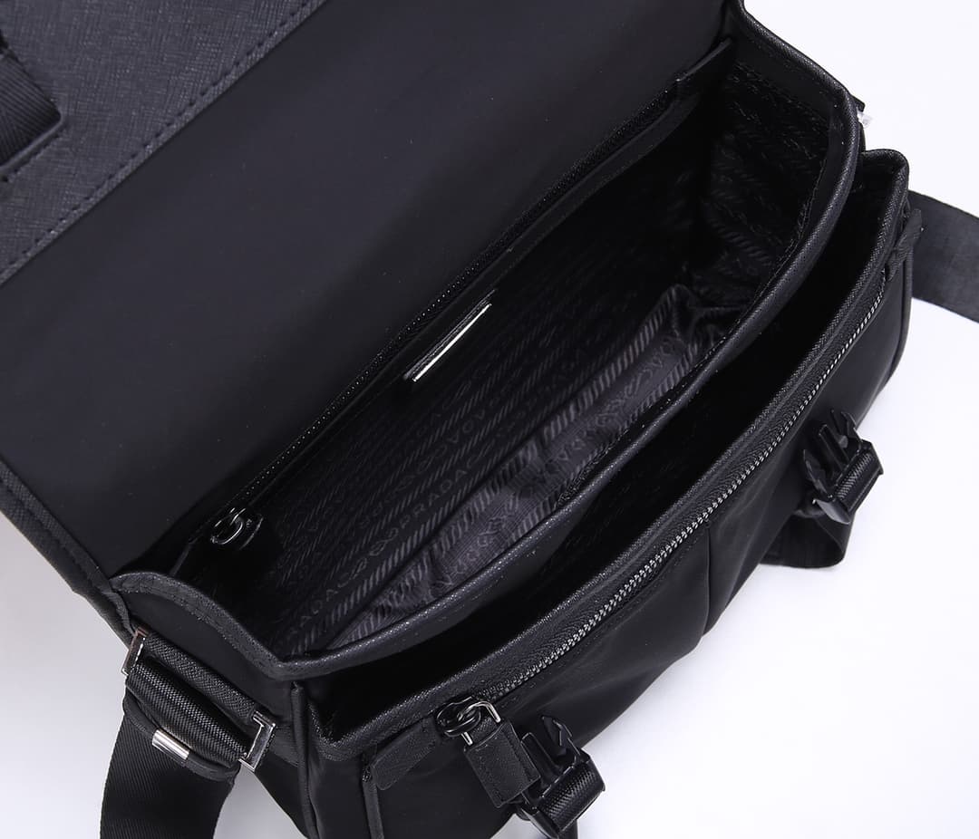 C7016 Prada new delivery bag 2VD769😎 Made of nylon material with Saffiano leather detailing. Adjustable shoulder strap. Two flap closures with buckles. Zipper pocket on the back. Two pockets below the flap: one is a zipper pocket and the other is a flat p — image 8