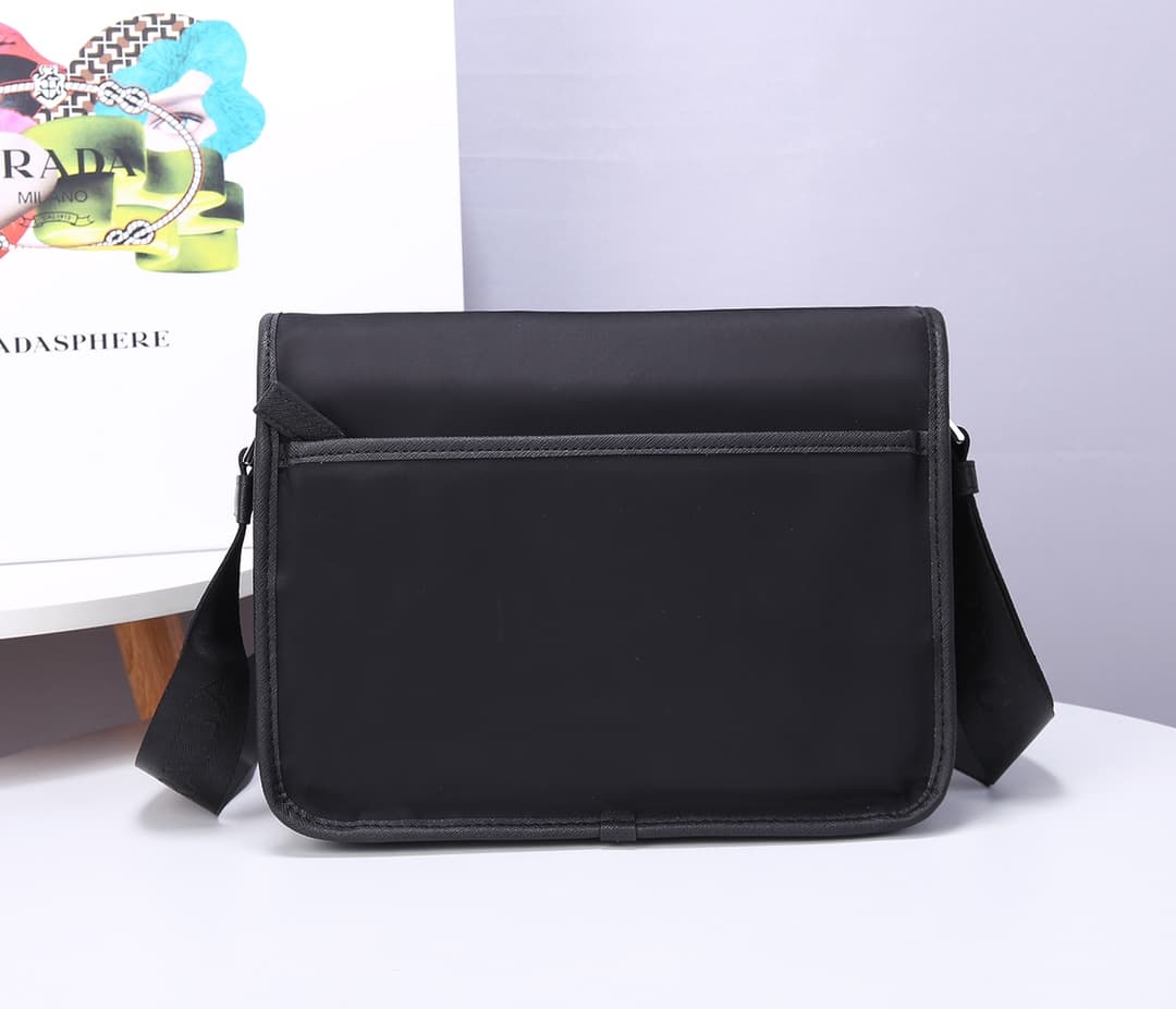 C7016 Prada new delivery bag 2VD769😎 Made of nylon material with Saffiano leather detailing. Adjustable shoulder strap. Two flap closures with buckles. Zipper pocket on the back. Two pockets below the flap: one is a zipper pocket and the other is a flat p — image 3