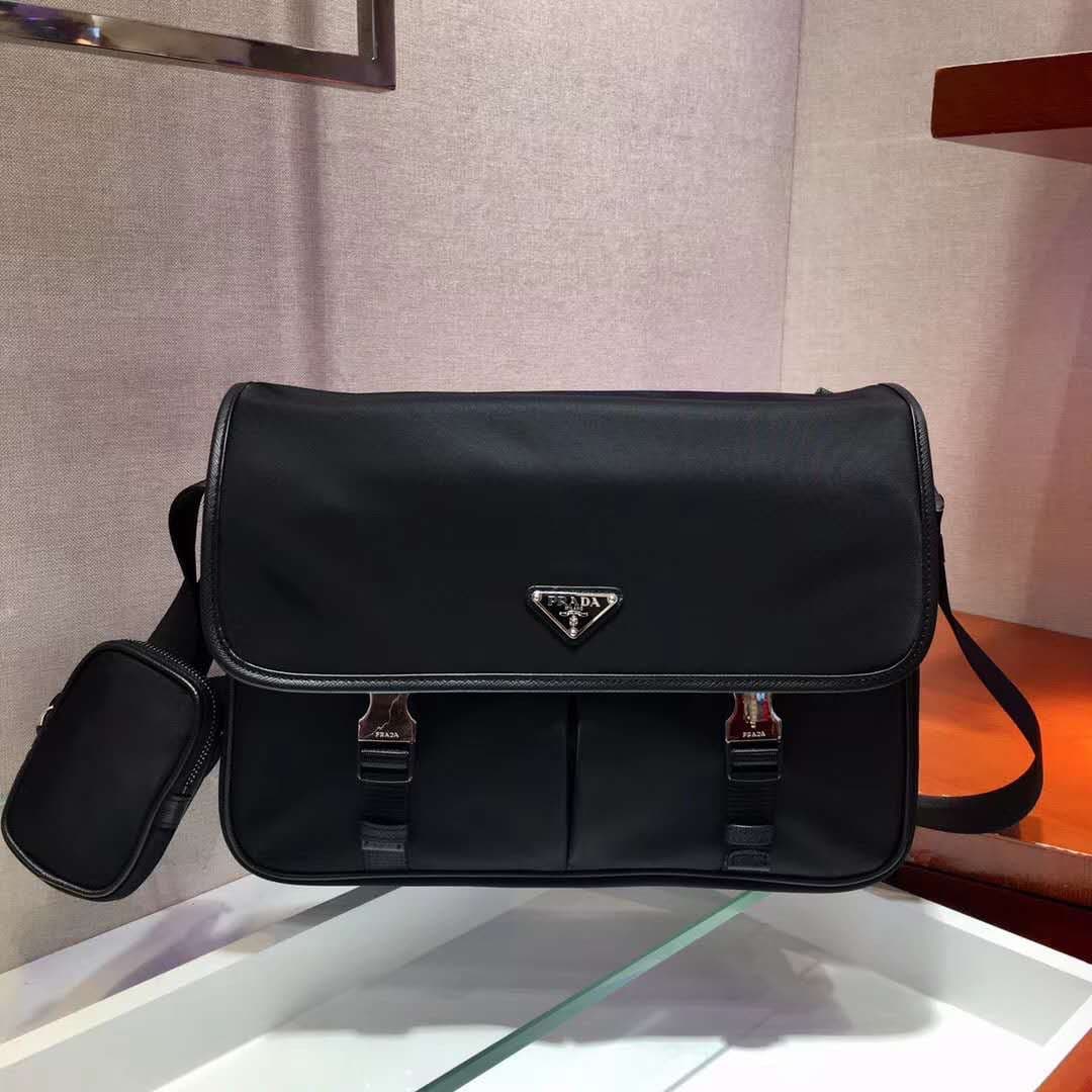 C7013 P Store boutique’s latest model 😎 Men’s crossbody bag 2VD768 has arrived. Made of nylon, with Saffiano leather trim, metal hardware components, two side clasps, adjustable nylon shoulder strap, zippered small pocket, three external pockets – two of  — image 2