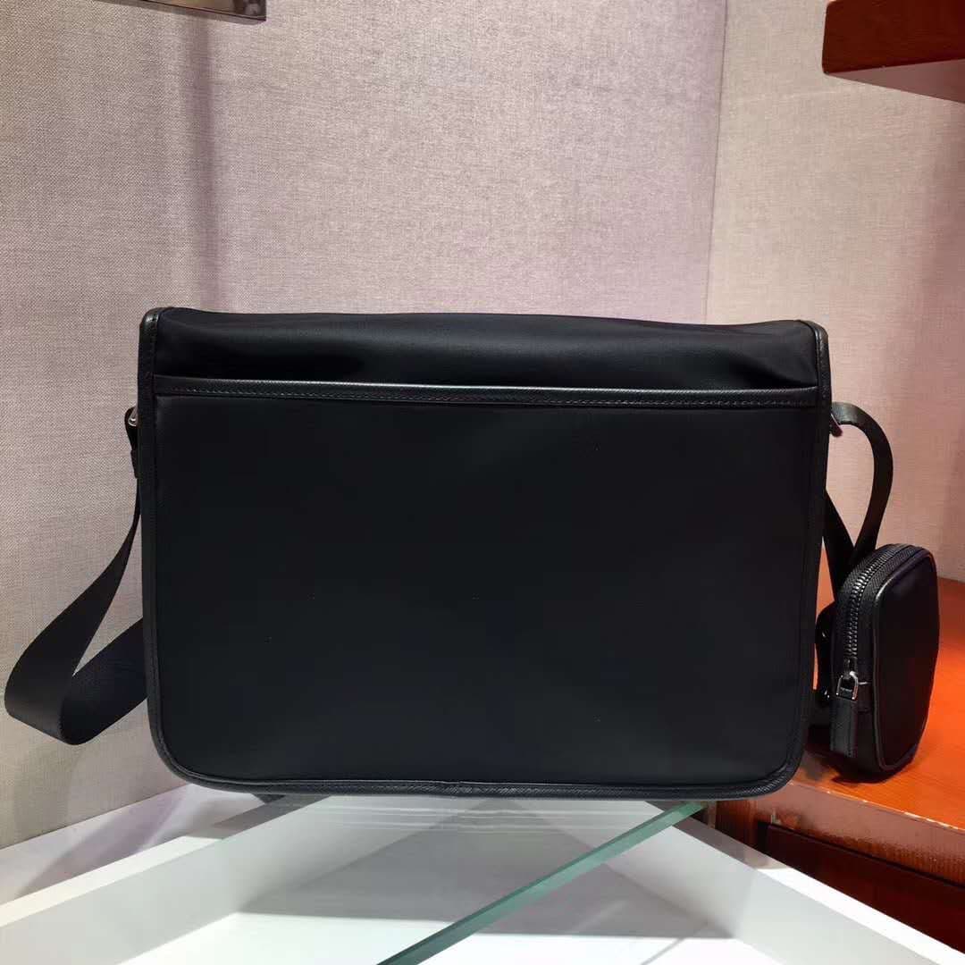 C7013 P Store boutique’s latest model 😎 Men’s crossbody bag 2VD768 has arrived. Made of nylon, with Saffiano leather trim, metal hardware components, two side clasps, adjustable nylon shoulder strap, zippered small pocket, three external pockets – two of  — image 4
