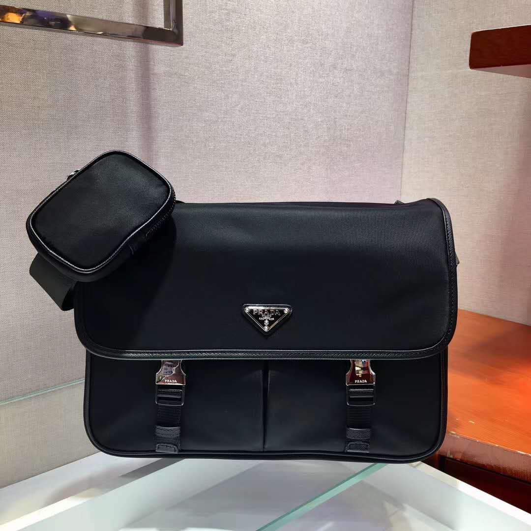 C7013 P Store boutique’s latest model 😎 Men’s crossbody bag 2VD768 has arrived. Made of nylon, with Saffiano leather trim, metal hardware components, two side clasps, adjustable nylon shoulder strap, zippered small pocket, three external pockets – two of  — image 1