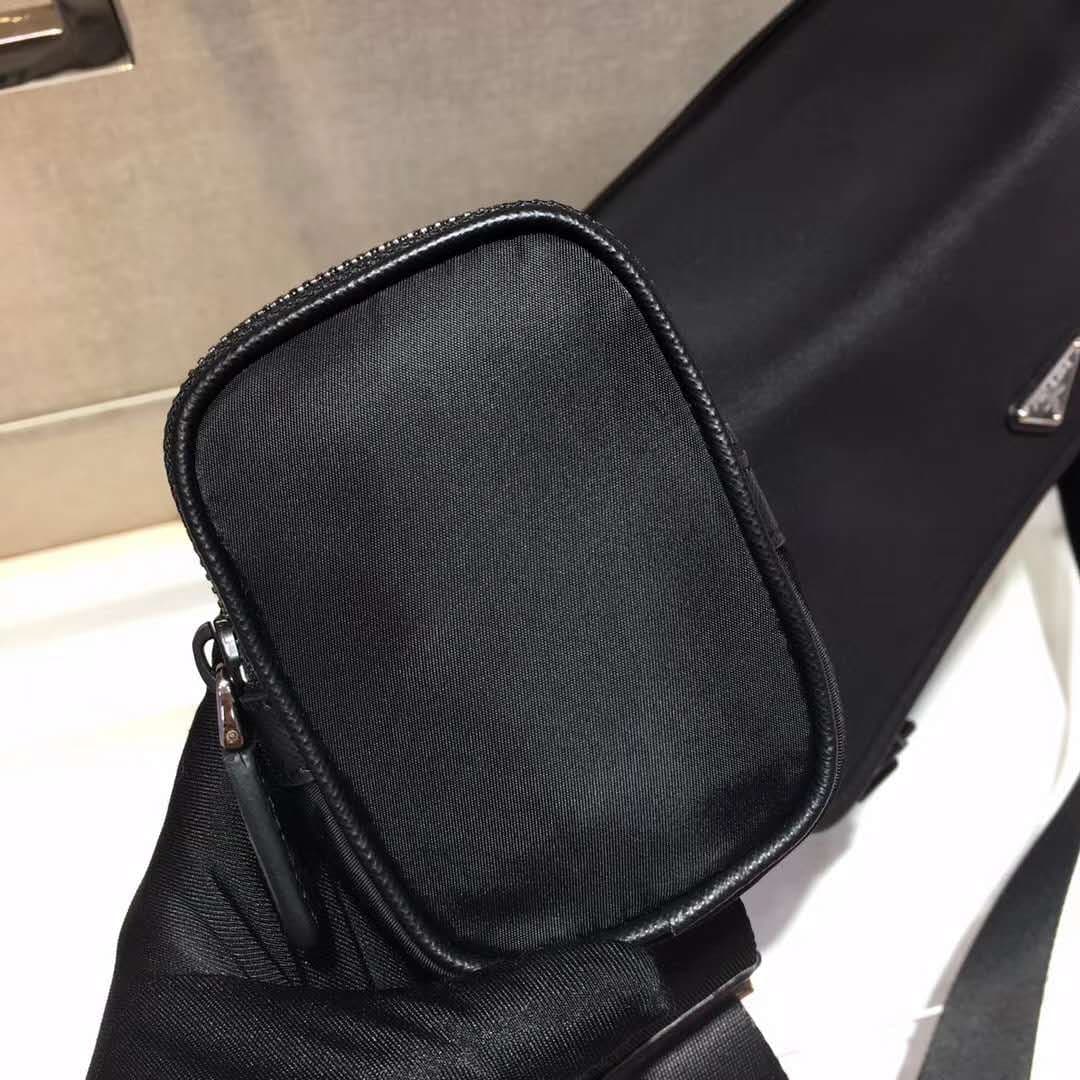 C7013 P Store boutique’s latest model 😎 Men’s crossbody bag 2VD768 has arrived. Made of nylon, with Saffiano leather trim, metal hardware components, two side clasps, adjustable nylon shoulder strap, zippered small pocket, three external pockets – two of  — image 8