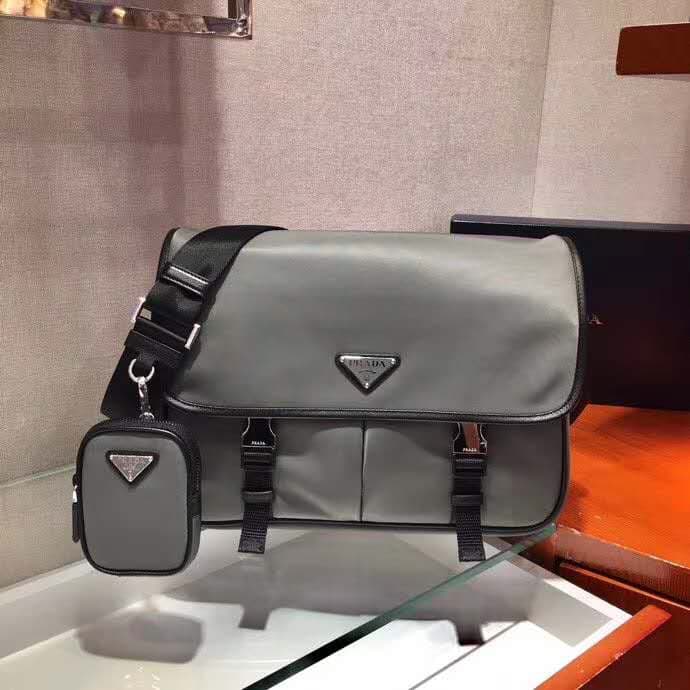 C7011 🎉New color 🎉2VD768B 🎉Original product 👍👍 This nylon flap handbag features classic Saffiano leather trim, with two side-opening zippers and a distinctive triangular metal logo. It showcases a stylish design, made from imported nylon and Saffiano leat — image 1