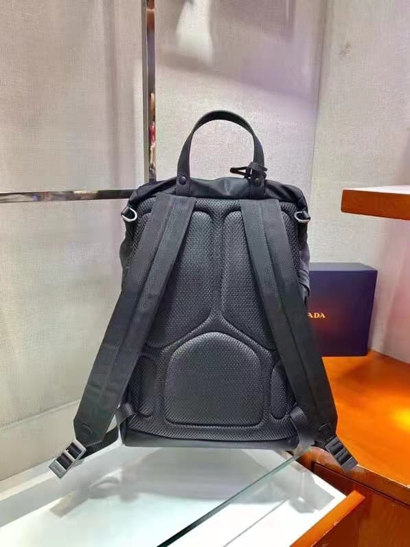 C7025 🎉 Environmental Protection Collection🎉2VZ135🎉🎉 This backpack is made from innovative recycled nylon material, featuring a classic design. It comes with a flap with straps and buttons, as well as four external zipper pockets. The back panel features  — image 4