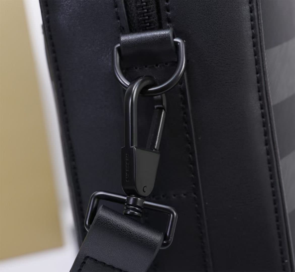 C8231 -B brand’s latest briefcase is crafted from checked and Italian tanned leather, with a branded logo design. It can be carried in a handheld format, or using detachable straps for shoulder carrying. At least 30% of the materials used in this product  — image 6