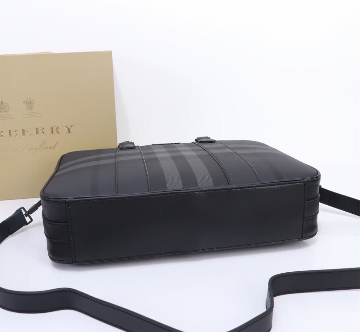 C8231 -B brand’s latest briefcase is crafted from checked and Italian tanned leather, with a branded logo design. It can be carried in a handheld format, or using detachable straps for shoulder carrying. At least 30% of the materials used in this product  — image 7