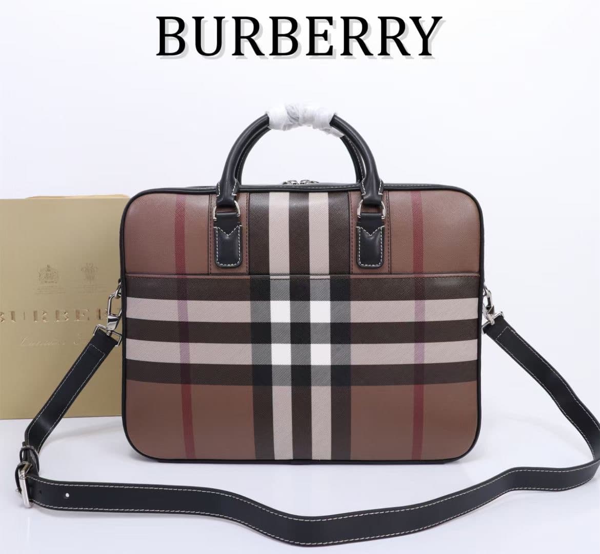 C8230 -B Brand’s latest briefcase is crafted from checked and Italian tanned leather, with a branded logo design. It can be carried in a handbag style, or worn on the shoulder using detachable straps. At least 30% of the materials used in this product are — image 2