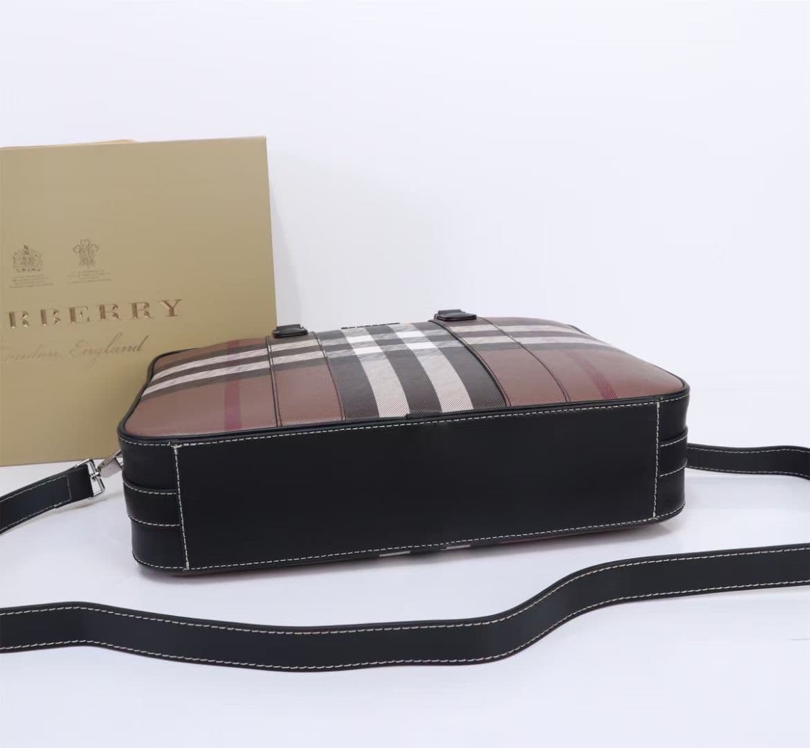 C8230 -B Brand’s latest briefcase is crafted from checked and Italian tanned leather, with a branded logo design. It can be carried in a handbag style, or worn on the shoulder using detachable straps. At least 30% of the materials used in this product are — image 6