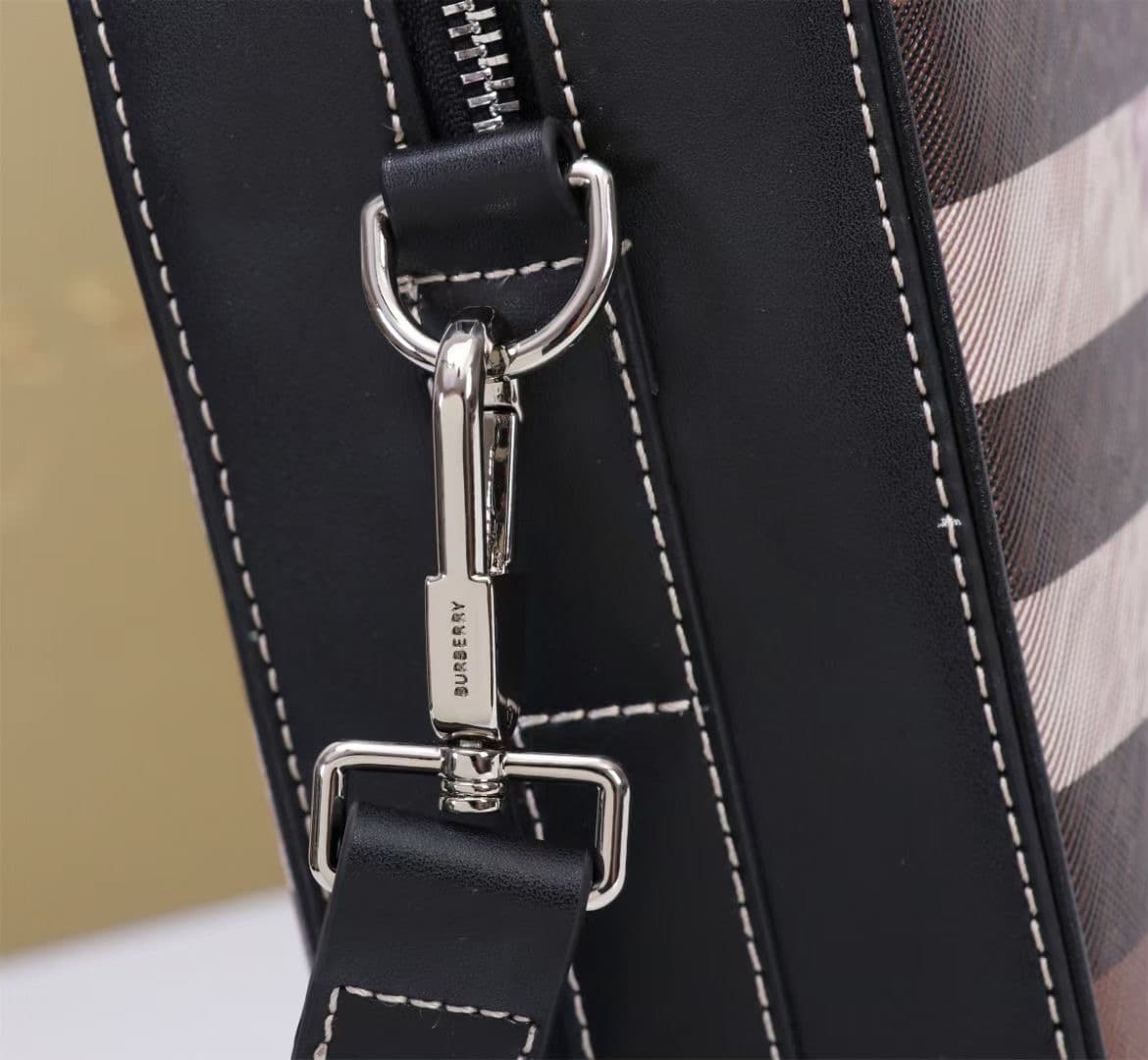C8230 -B Brand’s latest briefcase is crafted from checked and Italian tanned leather, with a branded logo design. It can be carried in a handbag style, or worn on the shoulder using detachable straps. At least 30% of the materials used in this product are — image 4