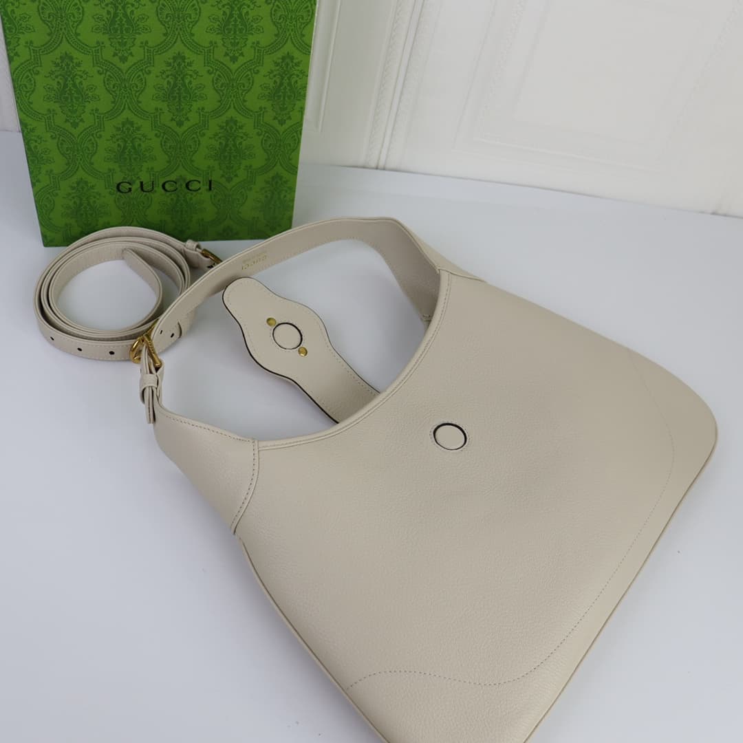 C4037 🌟 The “Aphrodite Collection” medium crescent-shaped shoulder bag. The “GucciCosmogonie” collection is presented at the historic Monte Carlo in Italy. On the runway, aesthetic elements from different times and locations blend together, connecting the — image 7