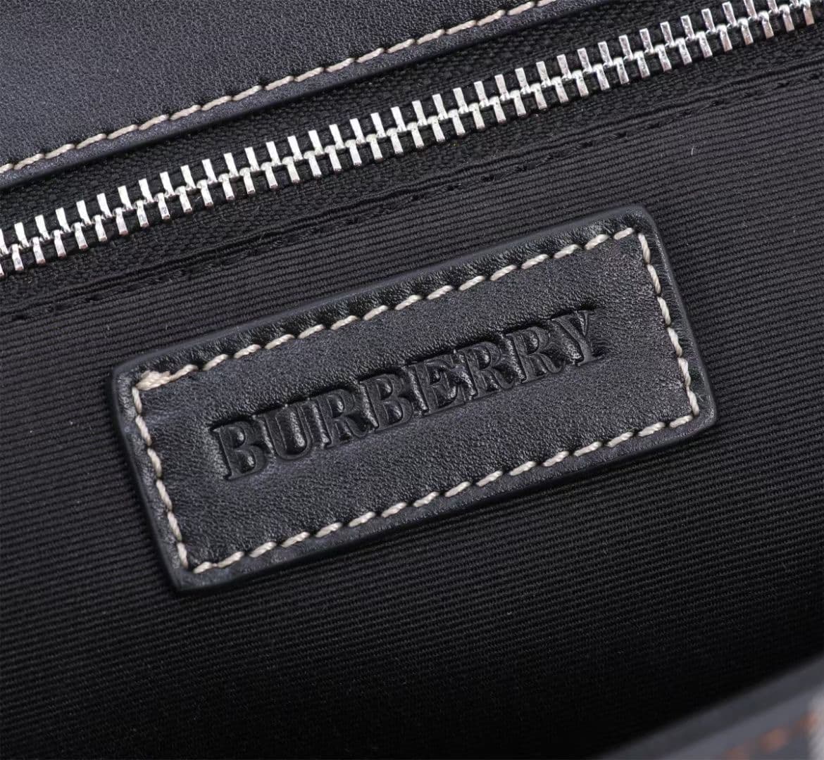 C142 The Balmain messenger bag features a structured design, with a brand’s charcoal-gray pattern. It is decorated with smooth leather details and an emblem design. There is a zipper pocket for storing small items. The adjustable shoulder strap ensures a  — image 8