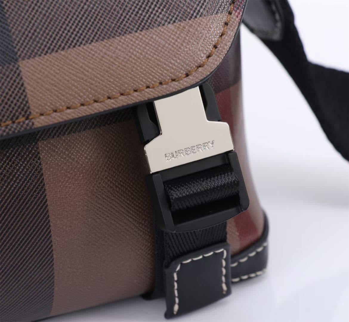 C142 The Balmain messenger bag features a structured design, with a brand’s charcoal-gray pattern. It is decorated with smooth leather details and an emblem design. There is a zipper pocket for storing small items. The adjustable shoulder strap ensures a  — image 3