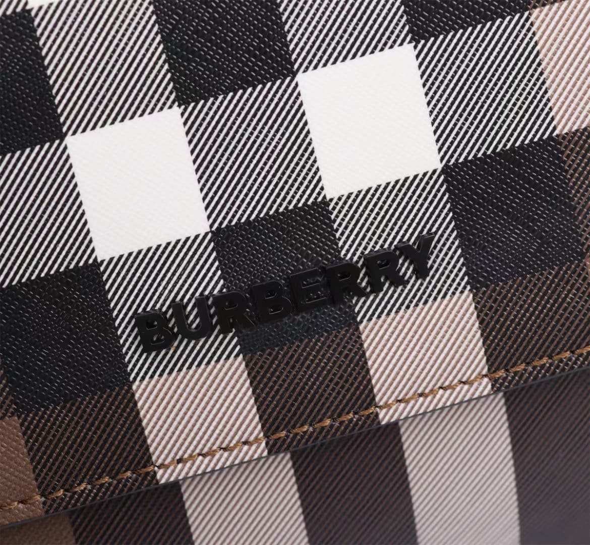 C142 The Balmain messenger bag features a structured design, with a brand’s charcoal-gray pattern. It is decorated with smooth leather details and an emblem design. There is a zipper pocket for storing small items. The adjustable shoulder strap ensures a  — image 2