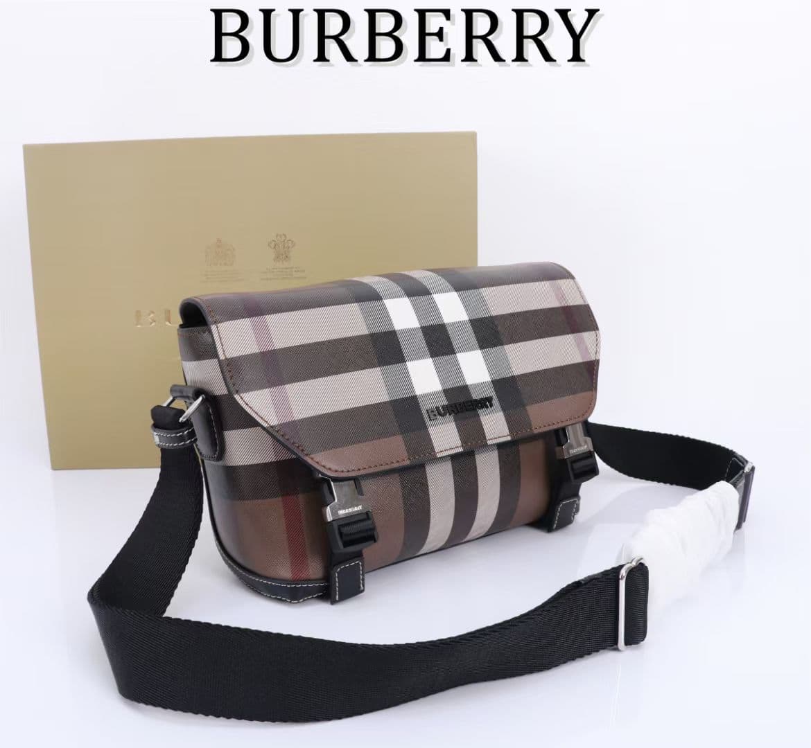 C142 The Balmain messenger bag features a structured design, with a brand’s charcoal-gray pattern. It is decorated with smooth leather details and an emblem design. There is a zipper pocket for storing small items. The adjustable shoulder strap ensures a  — image 7