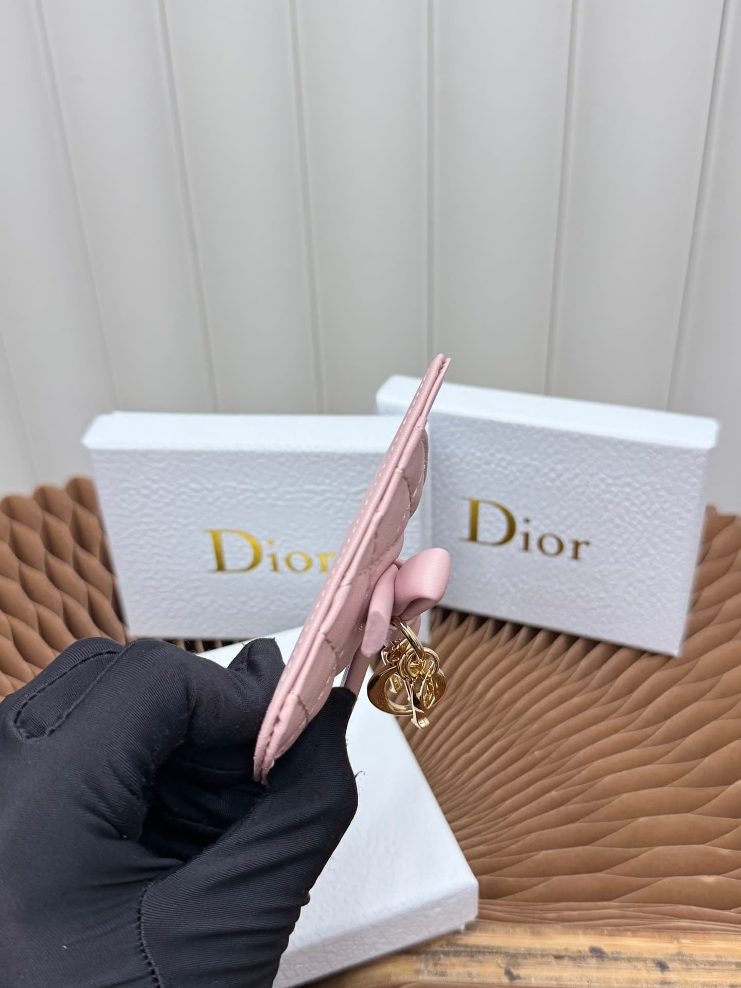 C389 This Lady Dior magnet card case is a delicate accessory that showcases the brand’s exquisite craftsmanship. The Cannage pattern in the lace style, along with the leather details, and the intricate bow ties represent new elements of Dior’s logo, highl — image 6