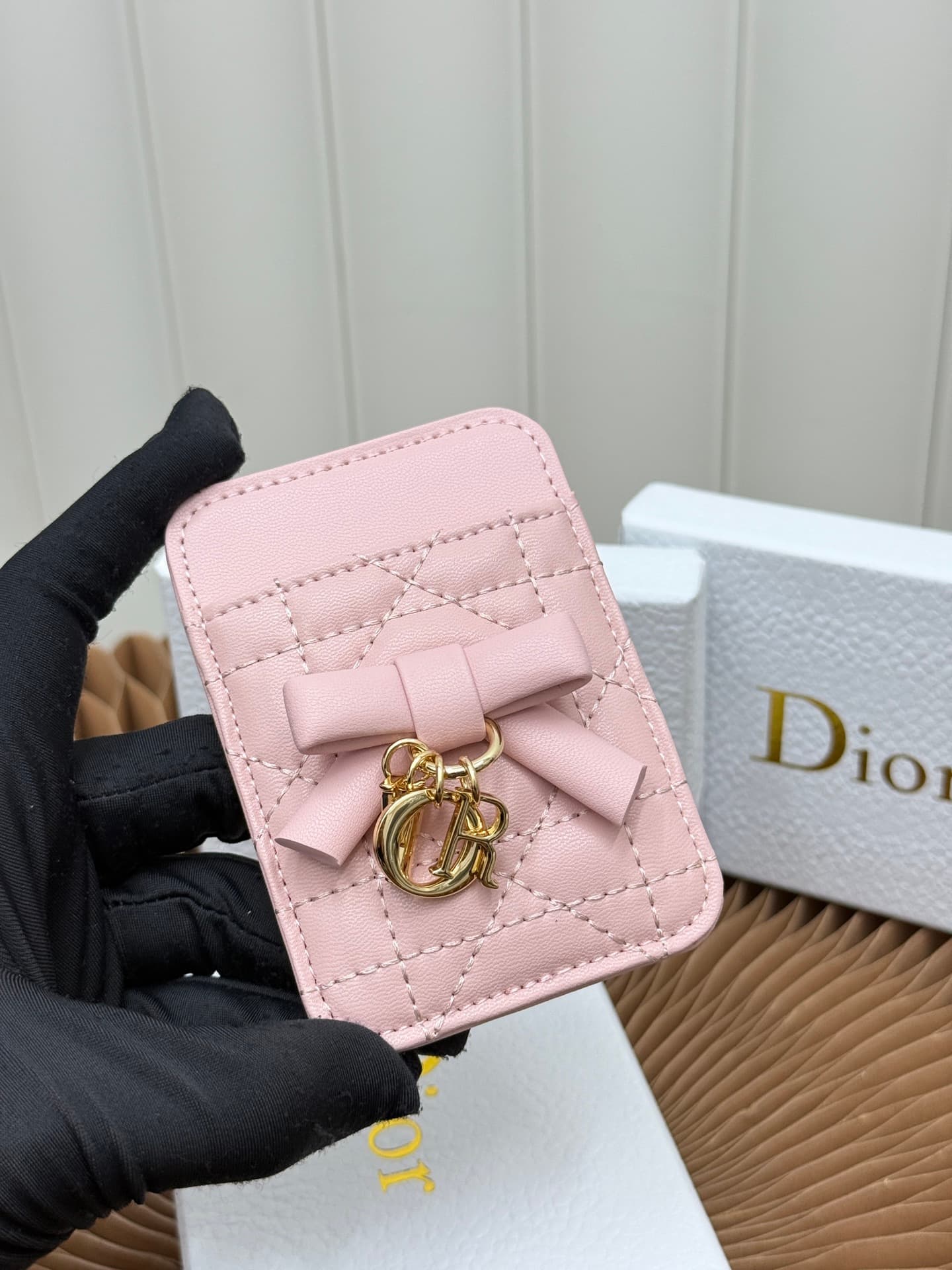 C389 This Lady Dior magnet card case is a delicate accessory that showcases the brand’s exquisite craftsmanship. The Cannage pattern in the lace style, along with the leather details, and the intricate bow ties represent new elements of Dior’s logo, highl — image 4