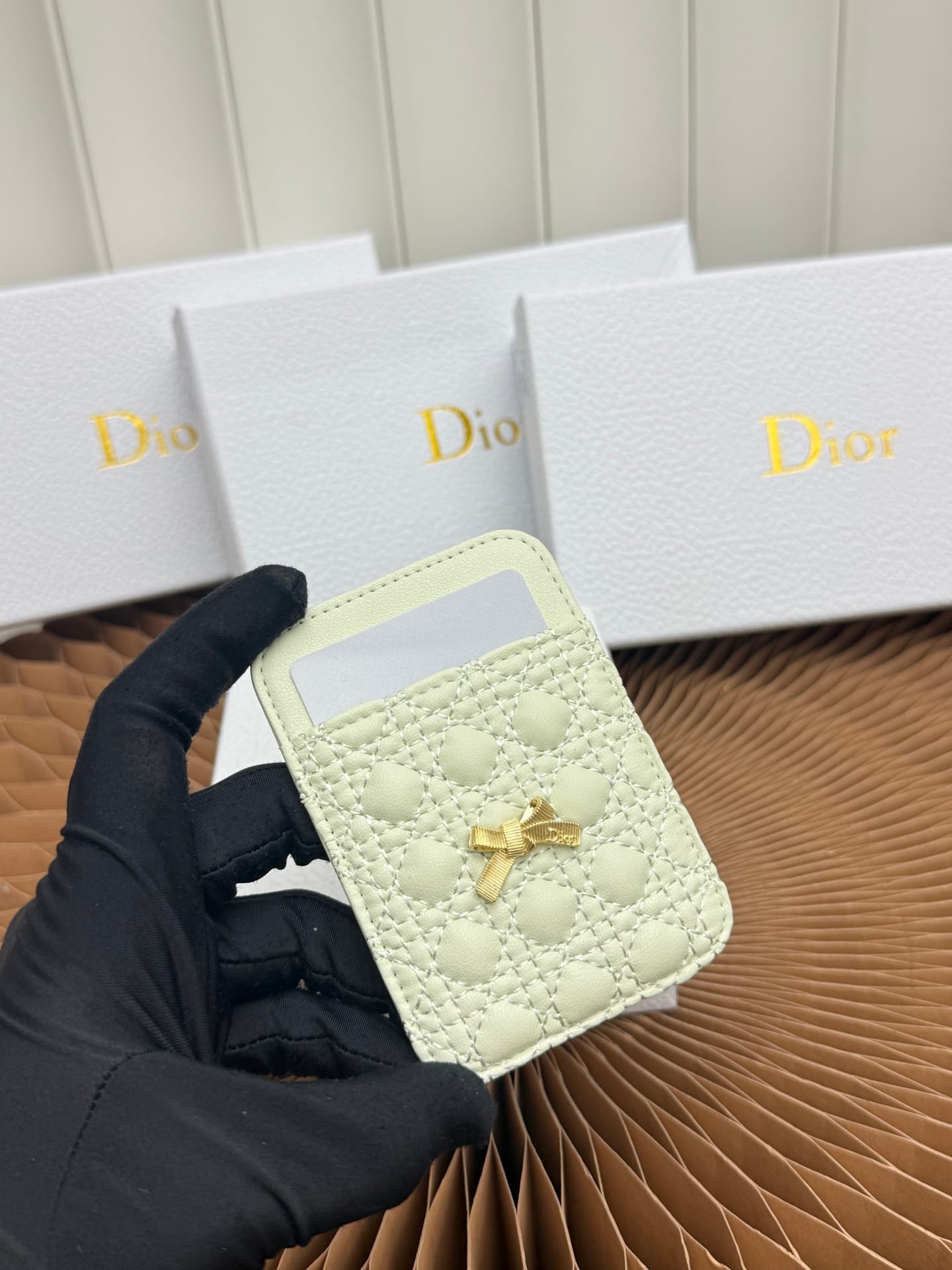 C393 This Baby Bow magnet card case is beautifully designed and practical. The black mini pattern with twill texture, along with the delicate bow ties, offer a clever new interpretation of the classic brand’s theme. This elegant card case can be used in c — image 4