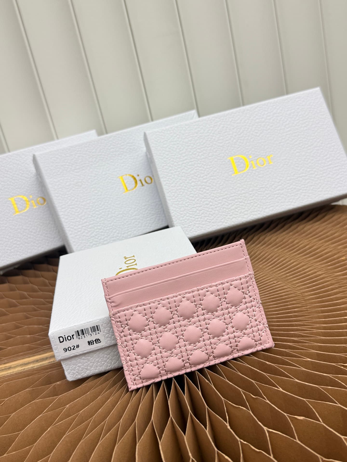 C395 This Baby Bow Freesia card case is designed in a elegant and practical manner. The black mini-check pattern with leather texture, along with delicate bow ties, offers a clever new interpretation of the classic brand’s theme. This exquisite accessory  — image 3