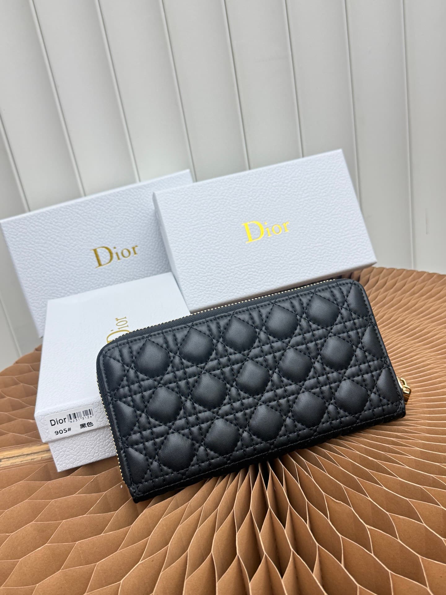 C403 This thin silver wallet from Baby Bow Voyageur is an essential accessory, exuding a simple and elegant style. The black mini boucle pattern on the lamb leather, combined with delicate bow ties, offers a clever new interpretation of the classic brand’ — image 3