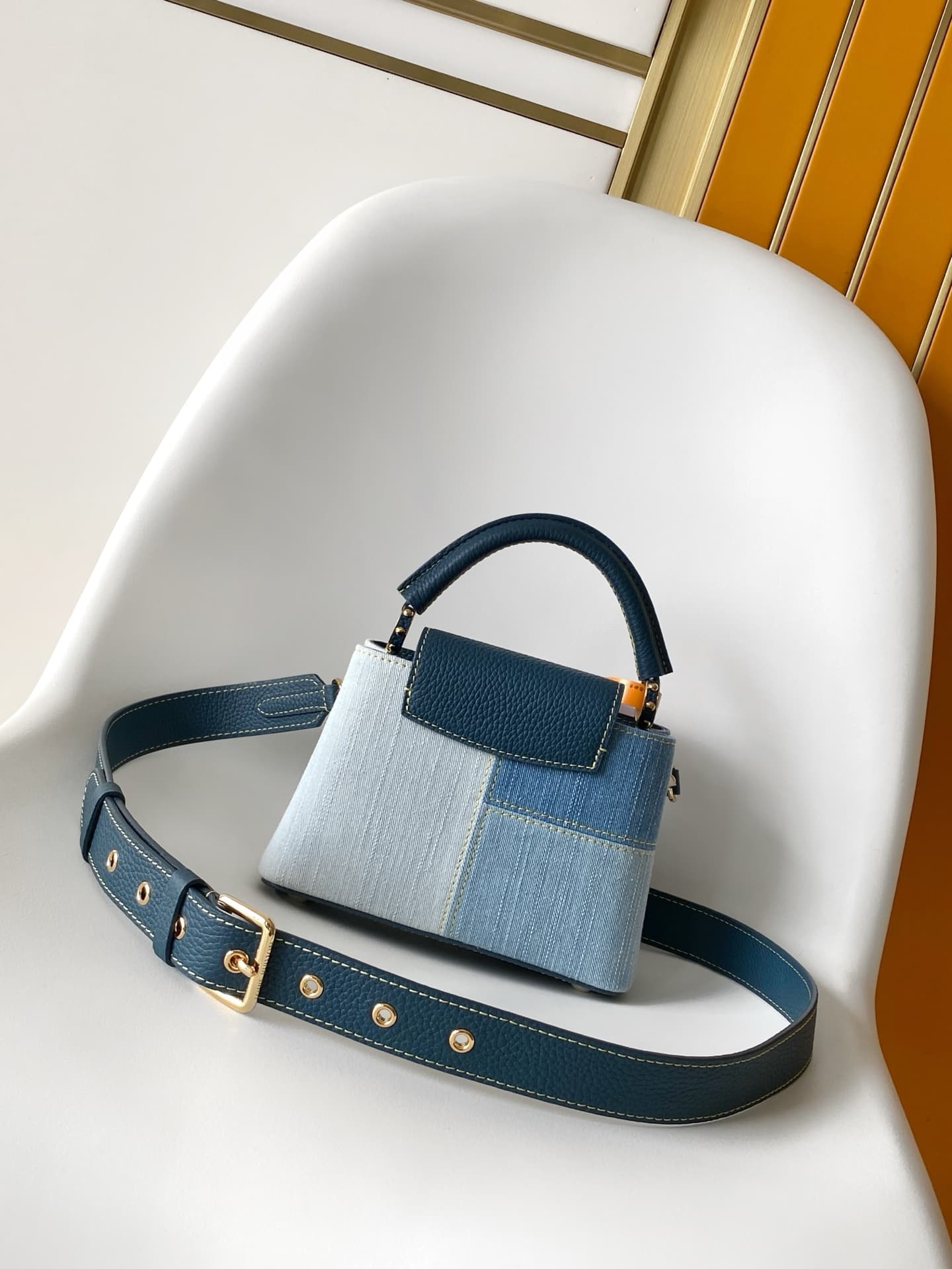 C5265 💰M27302 – Premium original style. The Capucines BB handbag features a denim material, reflecting contemporary fashion trends; its unique color-blocked design is distinctive. The bag comes with Taurillon leather handles, a flip cover, and a detachabl — image 3