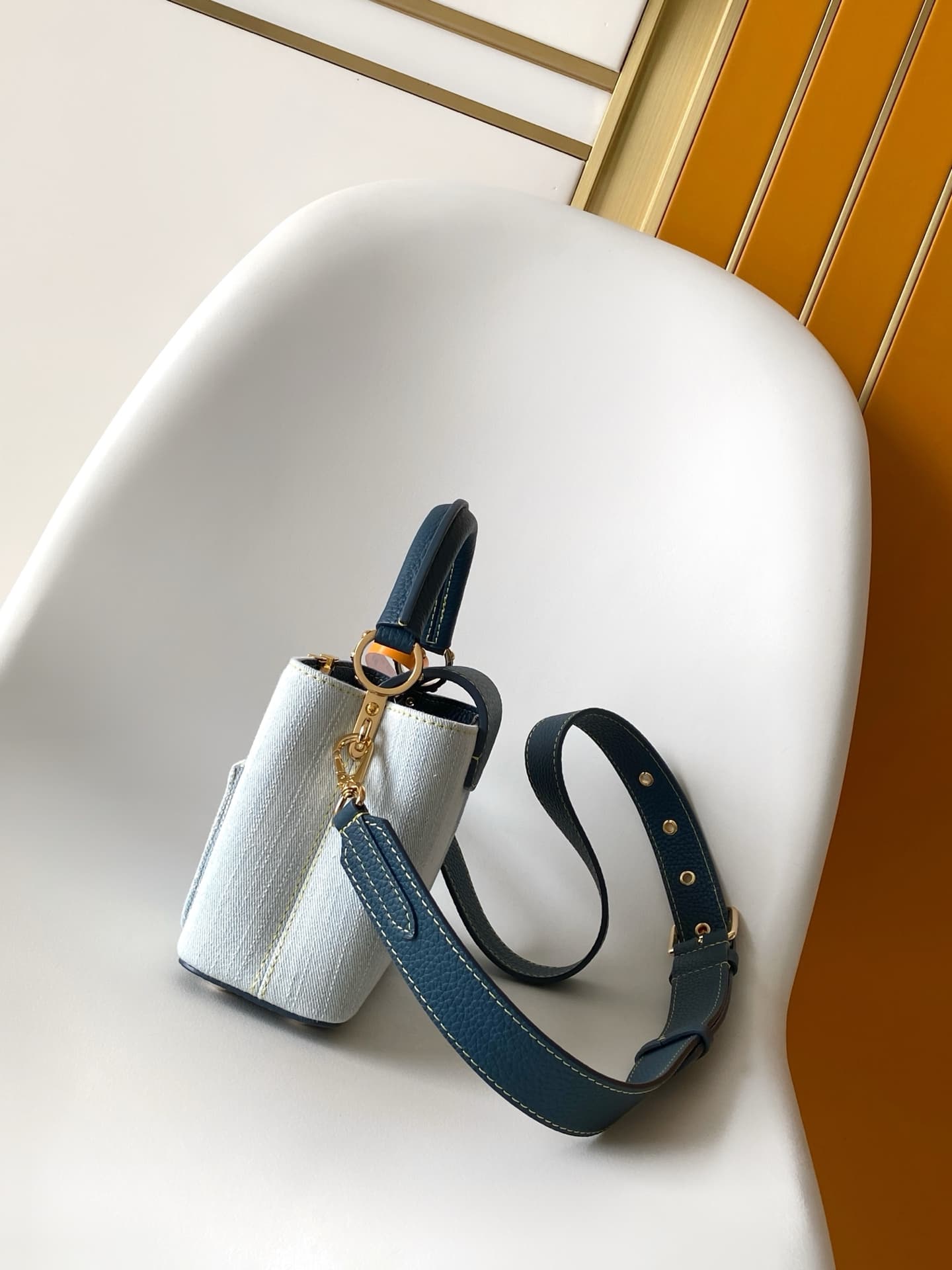 C5265 💰M27302 – Premium original style. The Capucines BB handbag features a denim material, reflecting contemporary fashion trends; its unique color-blocked design is distinctive. The bag comes with Taurillon leather handles, a flip cover, and a detachabl — image 2