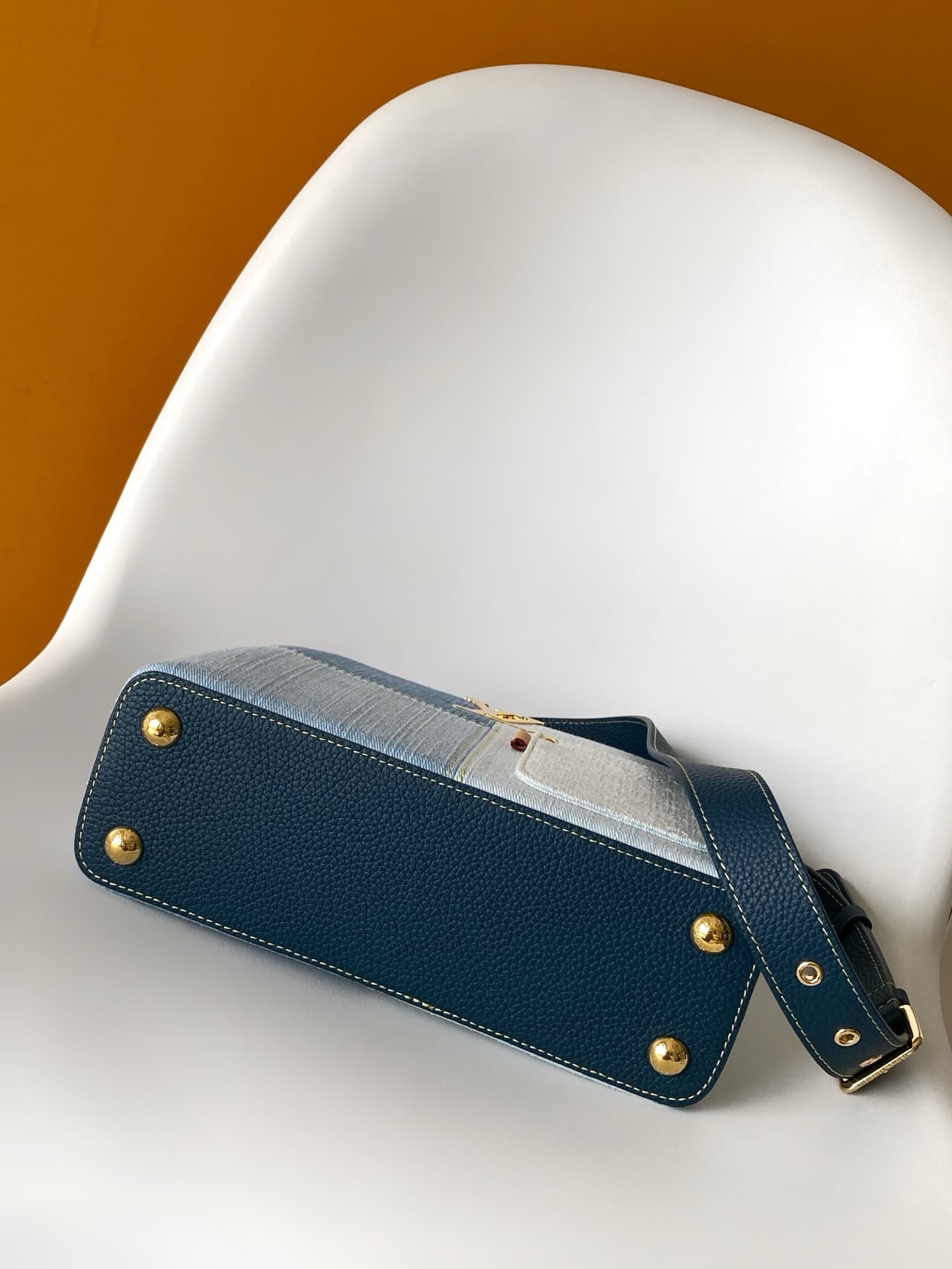 C5264 💰M27302 – Premium original style. The Capucines BB handbag features a denim material, reflecting contemporary fashion trends; its unique color-blocked design is truly distinctive. The bag comes with Taurillon leather handles, a flap closure, and a d — image 4