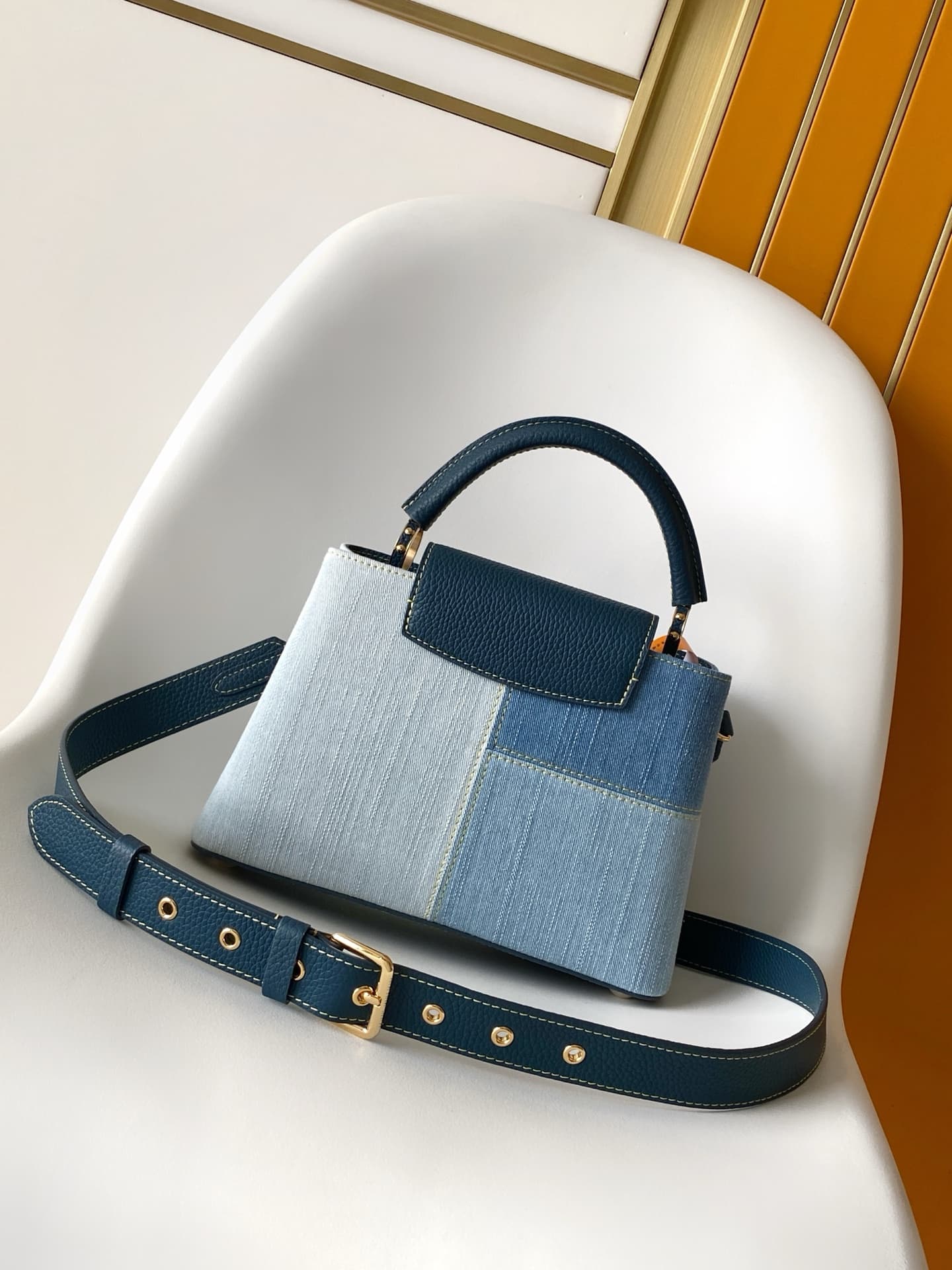C5264 💰M27302 – Premium original style. The Capucines BB handbag features a denim material, reflecting contemporary fashion trends; its unique color-blocked design is truly distinctive. The bag comes with Taurillon leather handles, a flap closure, and a d — image 3