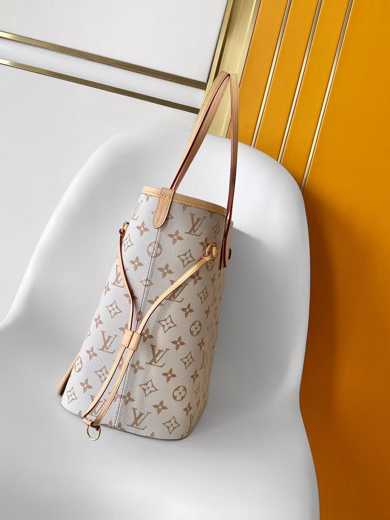 C5029 💰M2A095LVCrafty collection/series reimagines NeverfullMM handbags in the iconic sand dune color of MonogramDune, bringing a vibrant touch to summer wear. This model is made of canvas material, with leather lining and trim, and features colorful elem — image 2