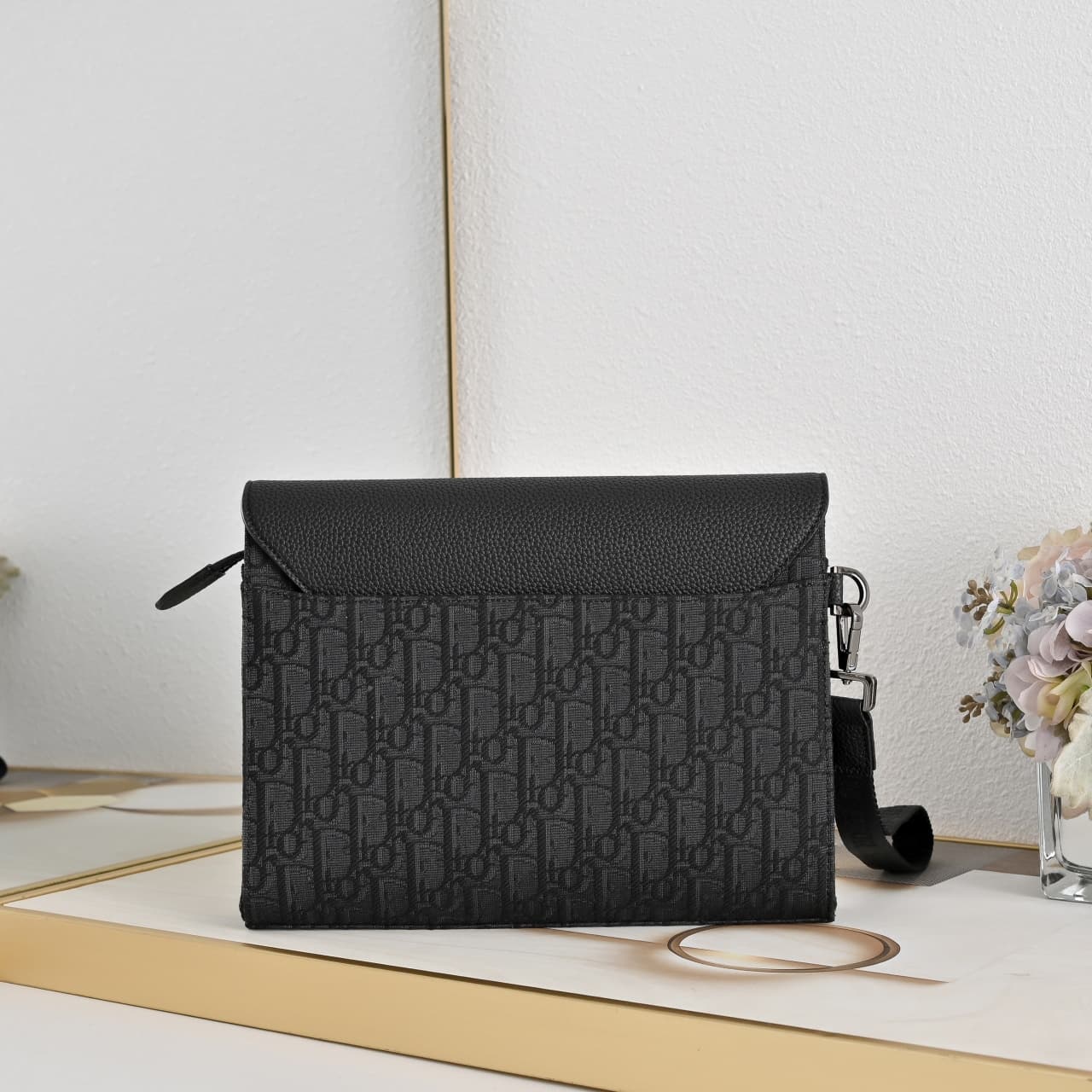 C1819 The A5 triangle-handbag is a new flagship product. It is crafted from beige and black Oblique print fabric, along with black grain leather for the flap design. The spacious zipper compartment can hold a phone, and there are also card slots. A detach — image 2