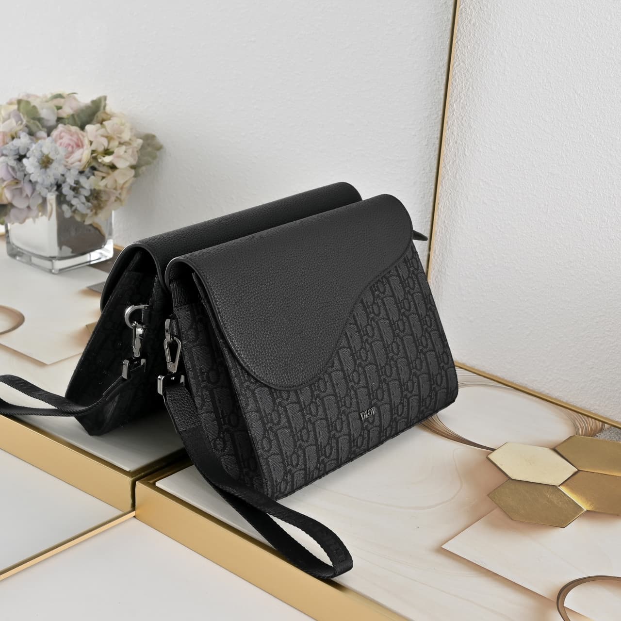 C1819 The A5 triangle-handbag is a new flagship product. It is crafted from beige and black Oblique print fabric, along with black grain leather for the flap design. The spacious zipper compartment can hold a phone, and there are also card slots. A detach — image 3