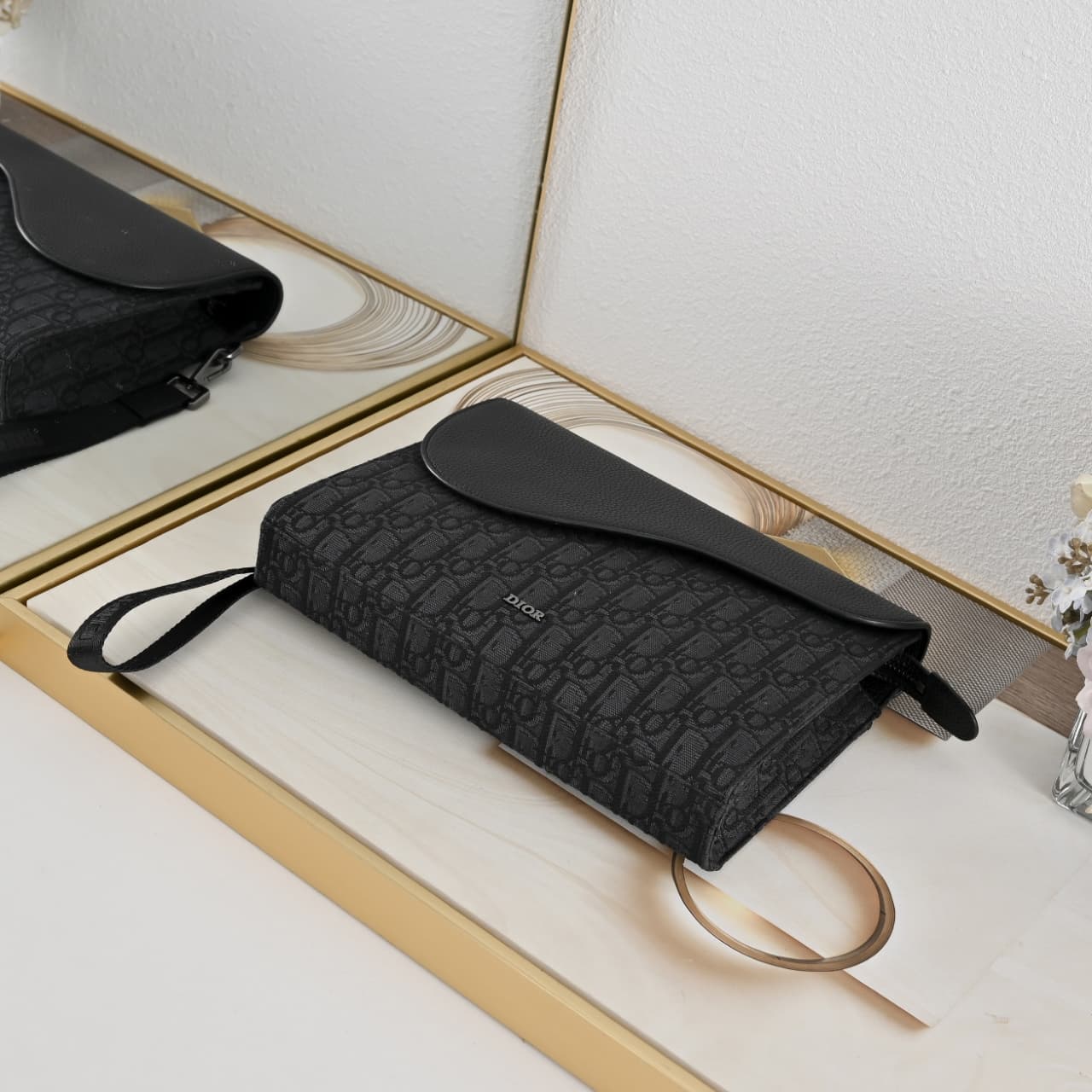 C1819 The A5 triangle-handbag is a new flagship product. It is crafted from beige and black Oblique print fabric, along with black grain leather for the flap design. The spacious zipper compartment can hold a phone, and there are also card slots. A detach — image 4