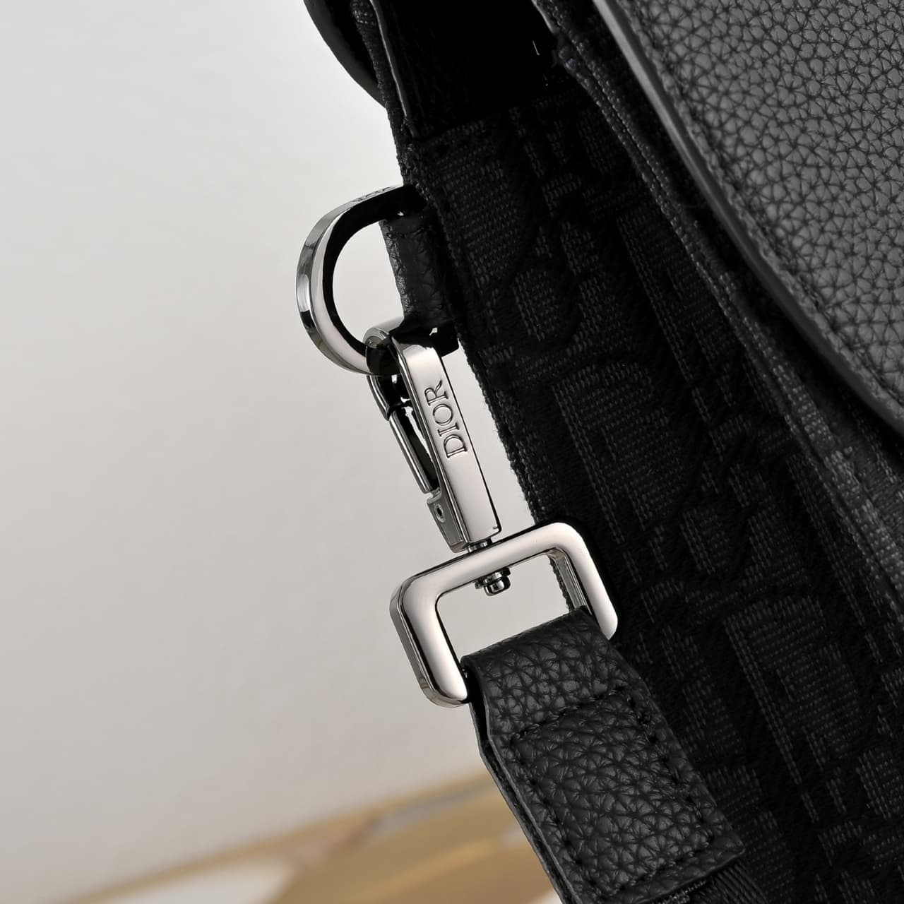 C1819 The A5 triangle-handbag is a new flagship product. It is crafted from beige and black Oblique print fabric, along with black grain leather for the flap design. The spacious zipper compartment can hold a phone, and there are also card slots. A detach — image 6