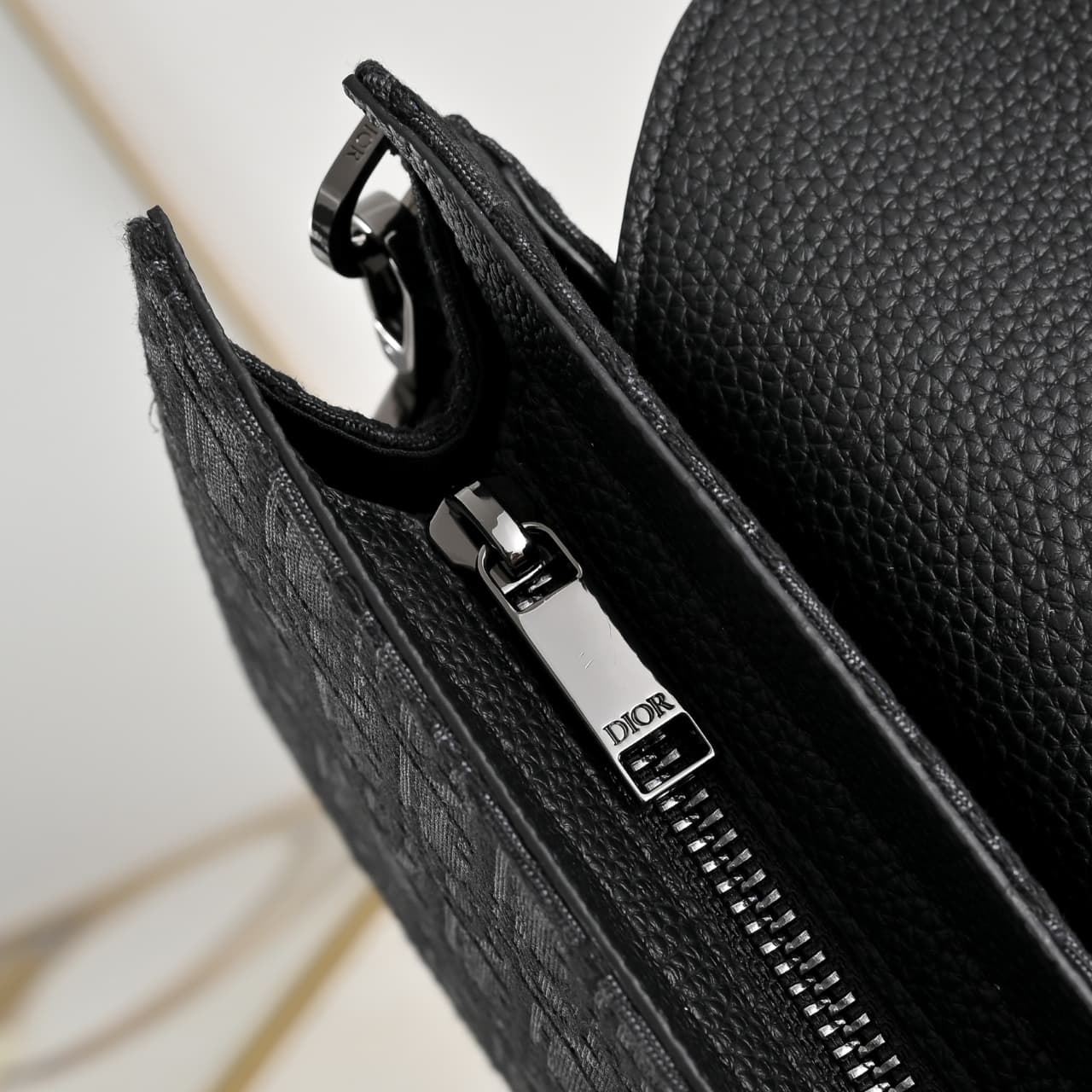 C1819 The A5 triangle-handbag is a new flagship product. It is crafted from beige and black Oblique print fabric, along with black grain leather for the flap design. The spacious zipper compartment can hold a phone, and there are also card slots. A detach — image 7