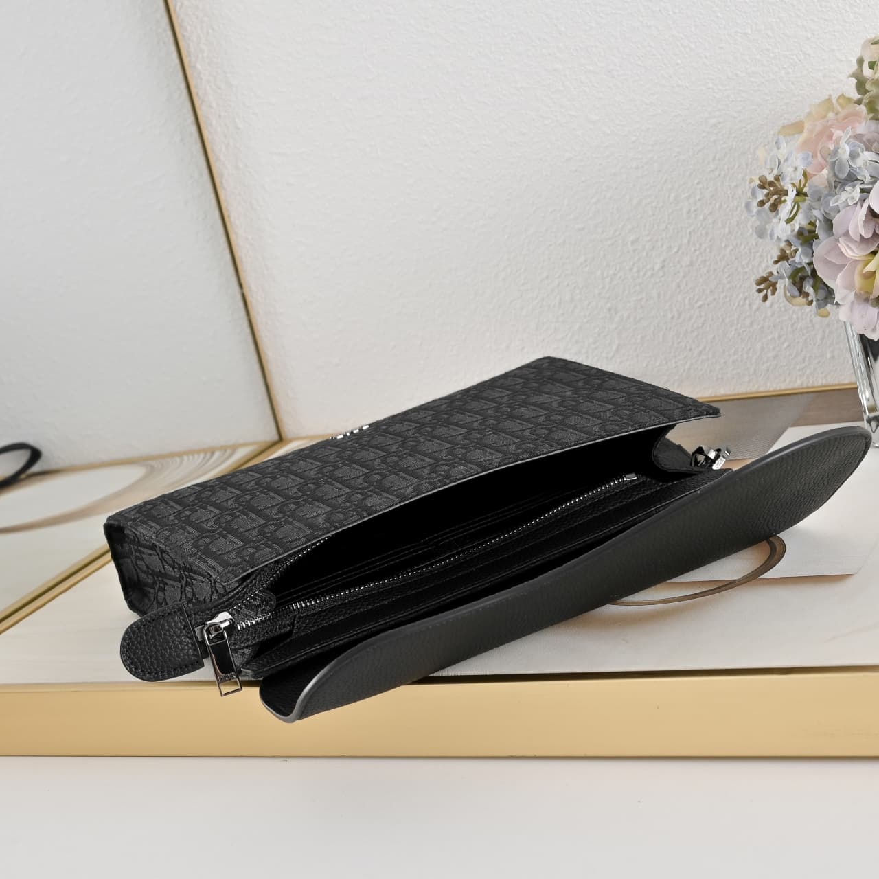 C1819 The A5 triangle-handbag is a new flagship product. It is crafted from beige and black Oblique print fabric, along with black grain leather for the flap design. The spacious zipper compartment can hold a phone, and there are also card slots. A detach — image 8