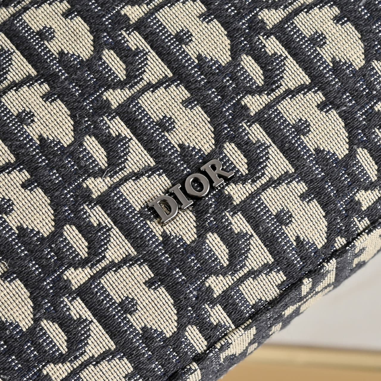 C1818 The A5 triangle-handbag is a new flagship product. It is crafted from beige and black Oblique-printed fabric, along with black suede leather with a saddle-shaped flap design. The spacious zipper compartment can hold a phone, and there are also card  — image 5