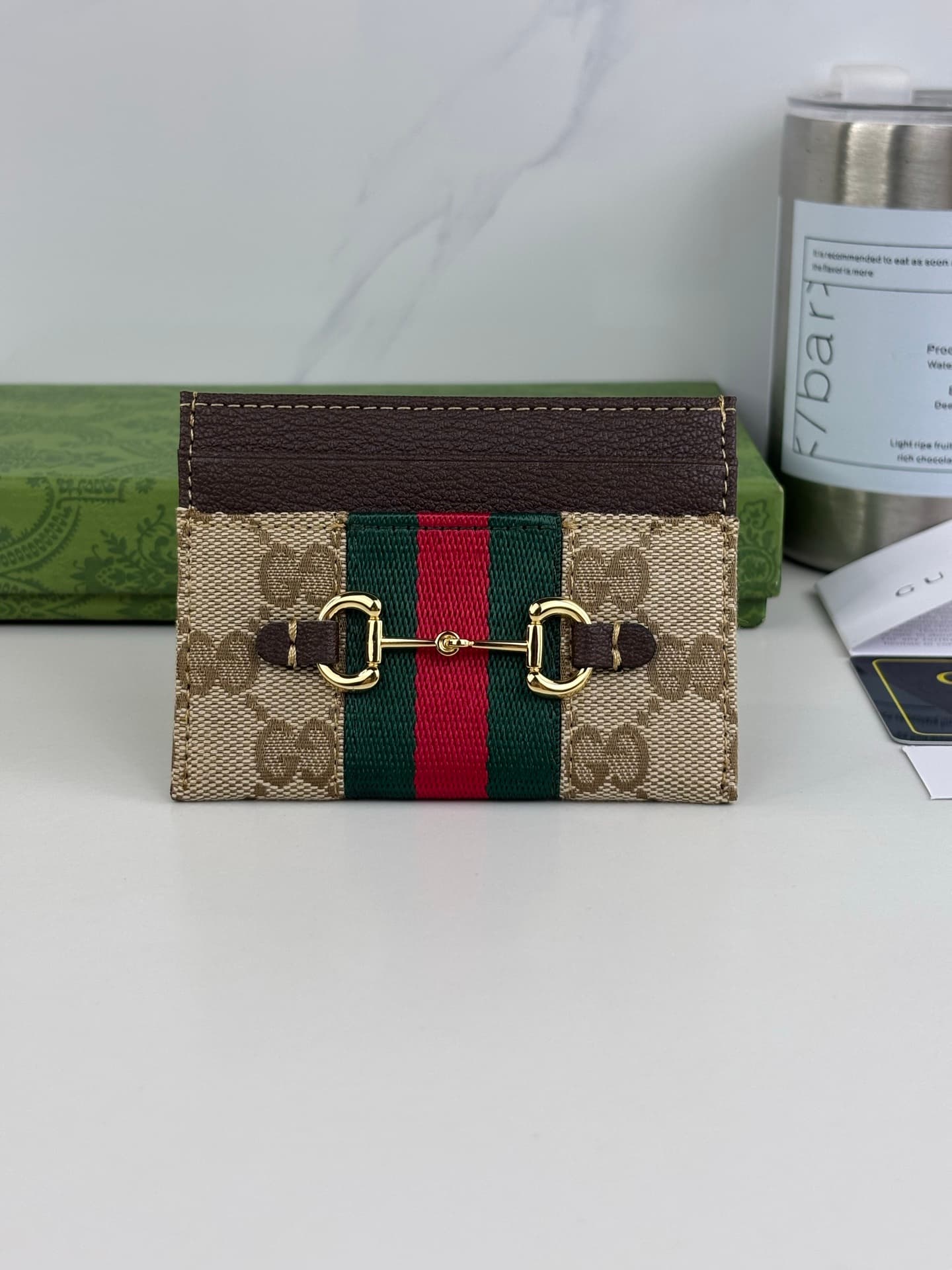 C3968 The Gucci Generation collection deeply explores the brand’s heritage elements, blending designs from different generations into a cohesive aesthetic narrative. The small accessories feature a tribute to the buckle design, integrating iconic details  — image 1