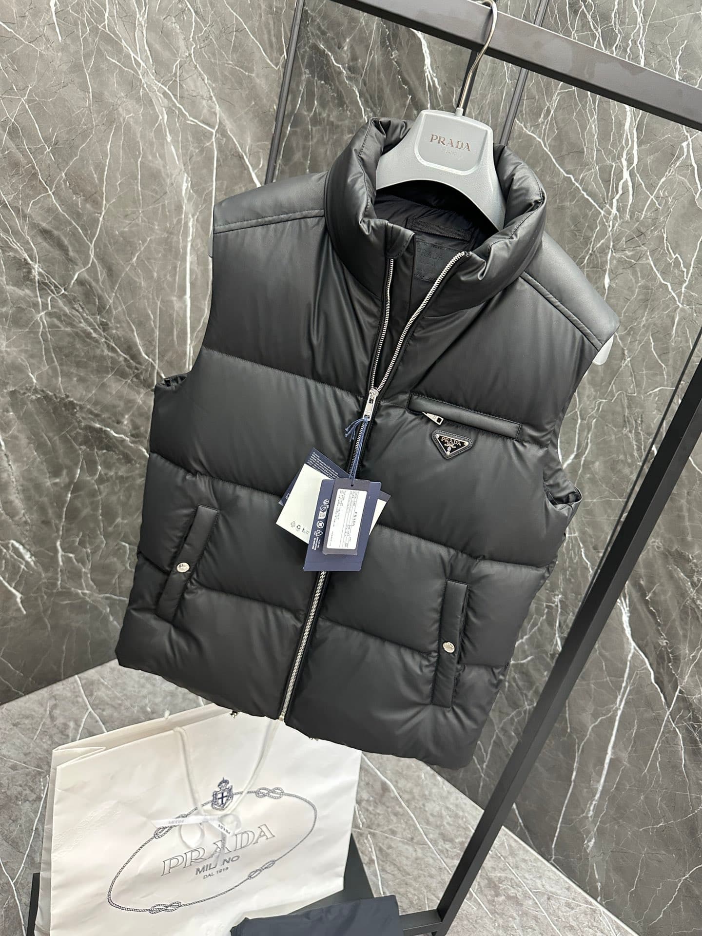 C11090 Premium down ⬆️PRADA technological membrane down vest. The fabric of this garment is made from the latest 24 technology, which retains the soft and delicate texture of羊skin. It is lighter and easier to maintain compared to conventional leather down — image 4