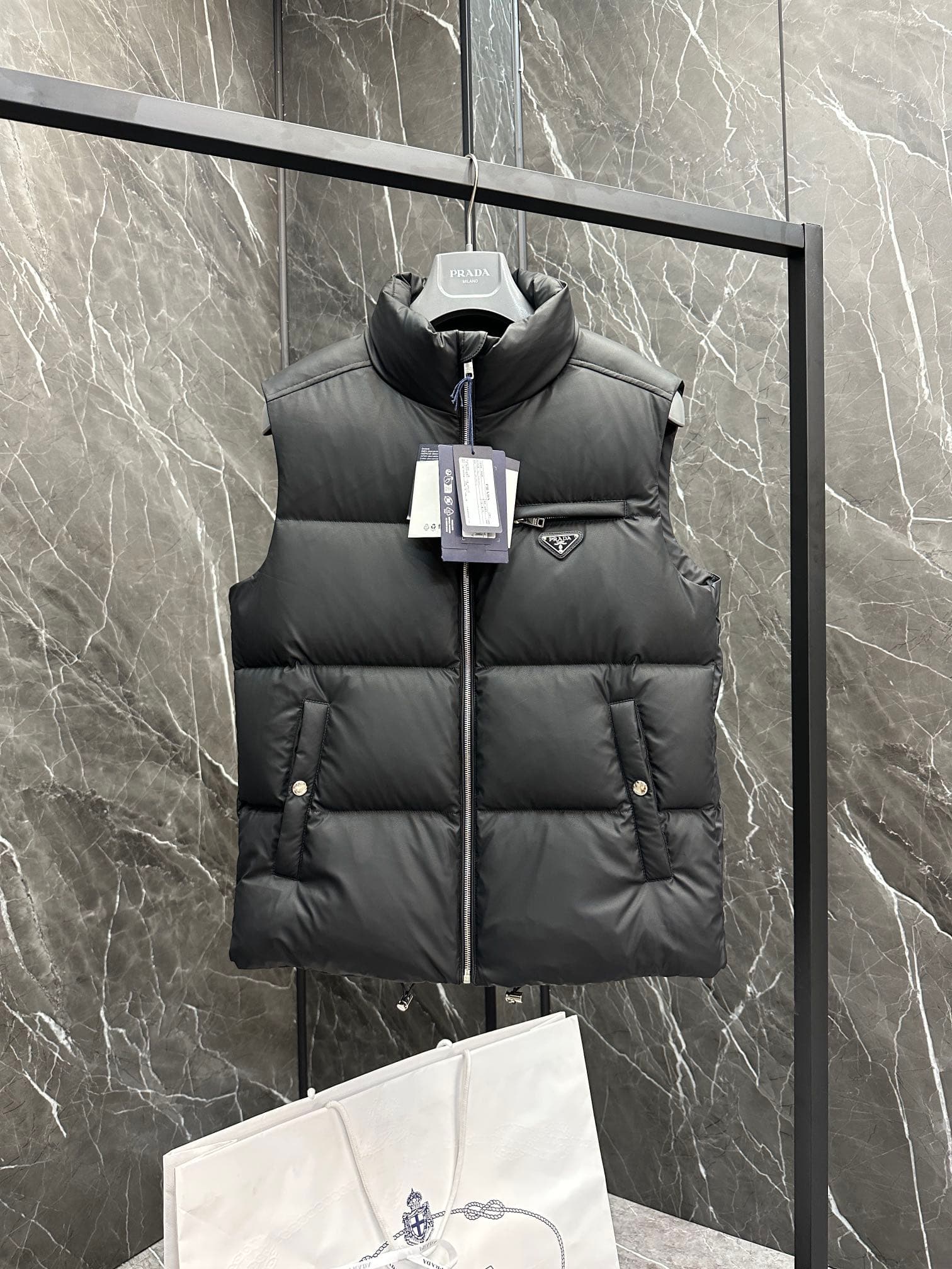 C11090 Premium down ⬆️PRADA technological membrane down vest. The fabric of this garment is made from the latest 24 technology, which retains the soft and delicate texture of羊skin. It is lighter and easier to maintain compared to conventional leather down — image 1