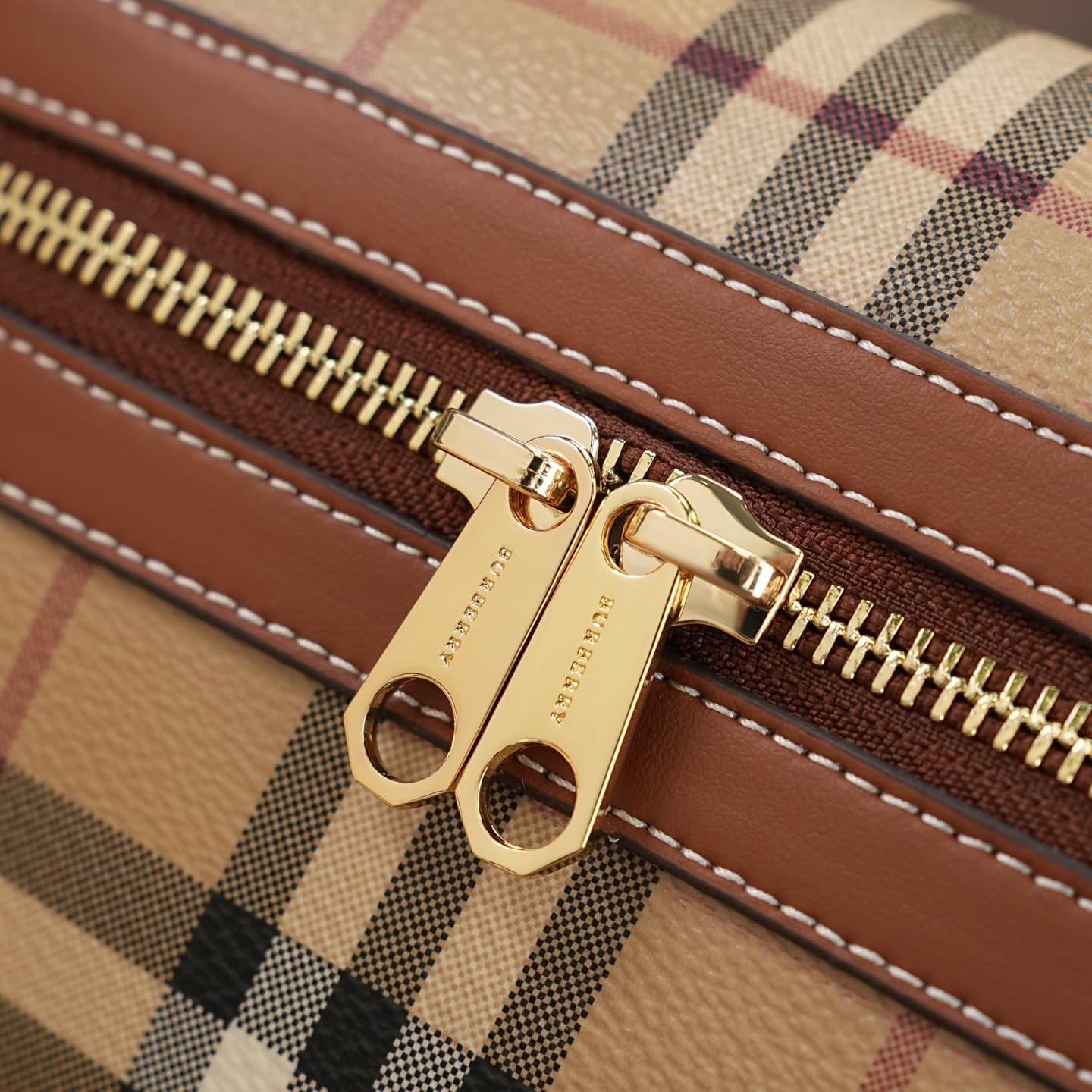 C92 The B family pattern Vanity bag is made from cotton-blend fabric and crafted by Italian artisans. It features a Burberry pattern print in the iconic classic beige color, along with leather trim with visible stitching. The bag has a structured design,  — image 4