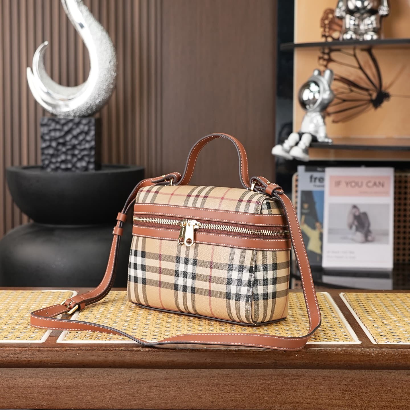 C92 The B family pattern Vanity bag is made from cotton-blend fabric and crafted by Italian artisans. It features a Burberry pattern print in the iconic classic beige color, along with leather trim with visible stitching. The bag has a structured design,  — image 2