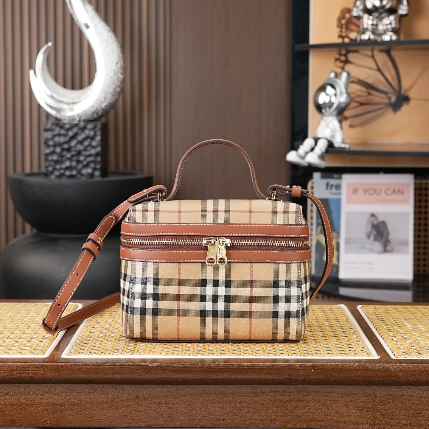 C92 The B family pattern Vanity bag is made from cotton-blend fabric and crafted by Italian artisans. It features a Burberry pattern print in the iconic classic beige color, along with leather trim with visible stitching. The bag has a structured design, — image 1
