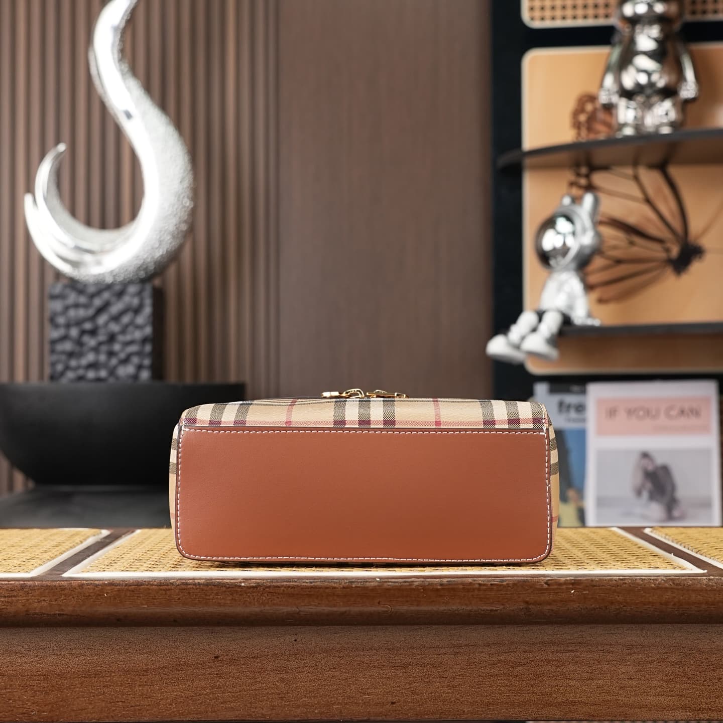 C92 The B family pattern Vanity bag is made from cotton-blend fabric and crafted by Italian artisans. It features a Burberry pattern print in the iconic classic beige color, along with leather trim with visible stitching. The bag has a structured design,  — image 7