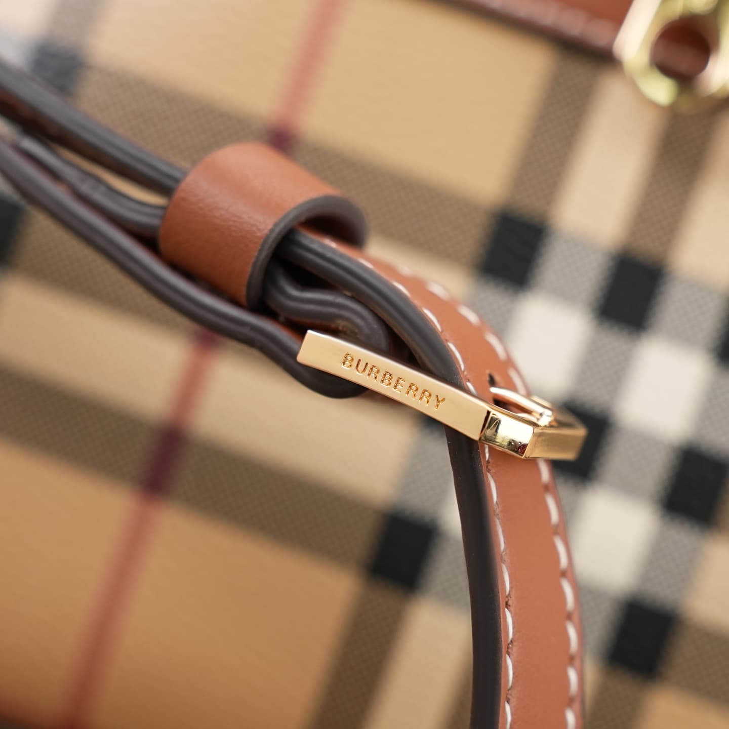 C92 The B family pattern Vanity bag is made from cotton-blend fabric and crafted by Italian artisans. It features a Burberry pattern print in the iconic classic beige color, along with leather trim with visible stitching. The bag has a structured design,  — image 6