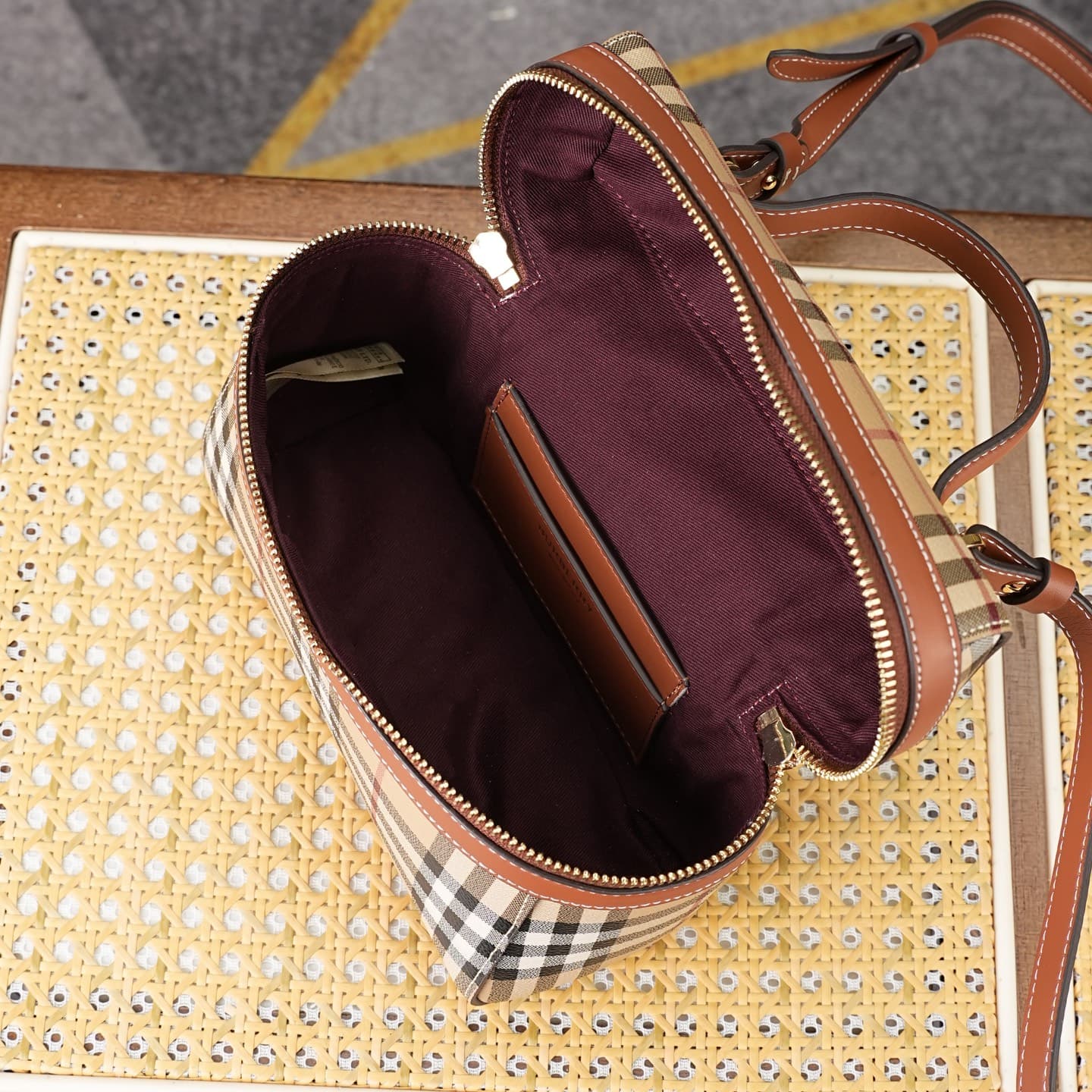 C92 The B family pattern Vanity bag is made from cotton-blend fabric and crafted by Italian artisans. It features a Burberry pattern print in the iconic classic beige color, along with leather trim with visible stitching. The bag has a structured design,  — image 8