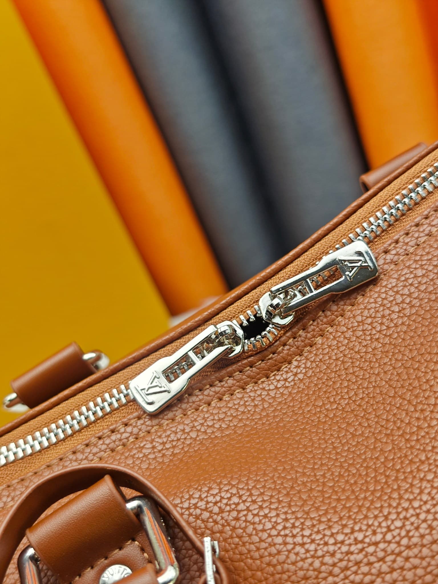 C5291 M41416 M26065 Brown. This Keepall Bandouliere 50 travel bag is made from polished cowhide leather and fabric lining, making it an excellent choice for weekend trips. The fine, soft leather and the LV logo exude elegance; the handle at the top and th — image 7