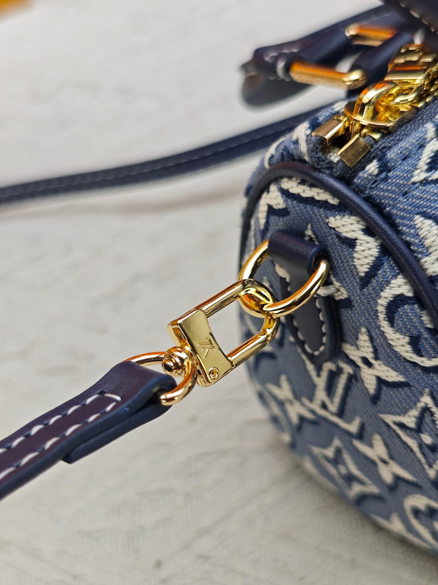 C5055 M28502  2A187  M81085 Batik. This Nano Speedy handbag features a delicate batik canvas design adorned with the Monogram Emblème logo. The bag’s body is styled in the traditional hard shell colors of the brand, and it comes with contrasting leather t — image 7