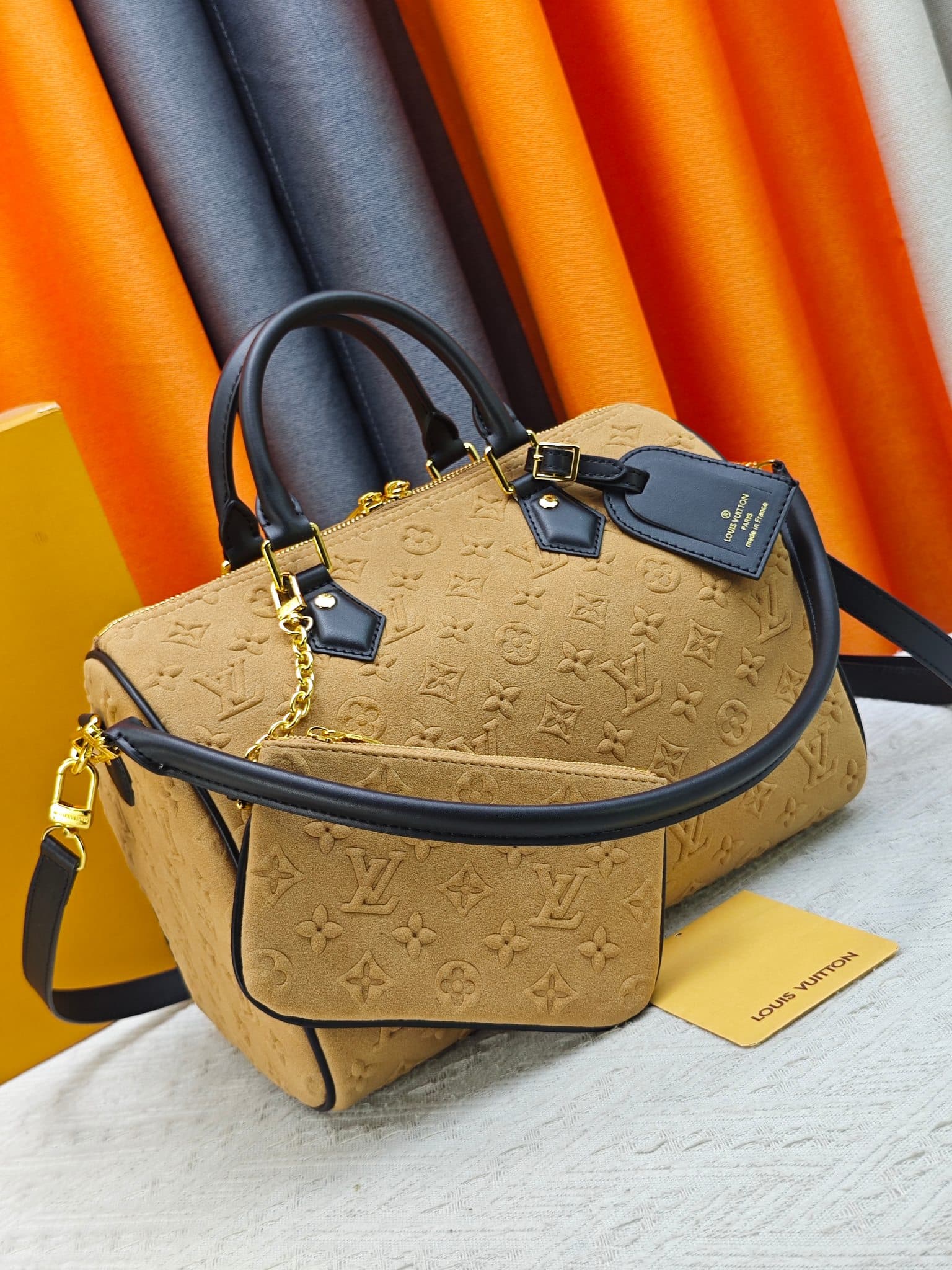 C5036 💰 M13332 M13344 Apricot-colored embossed suede, for shows. This model, Speedy Soft 30, is from LV Travels With Grace Coddlington. — image 2