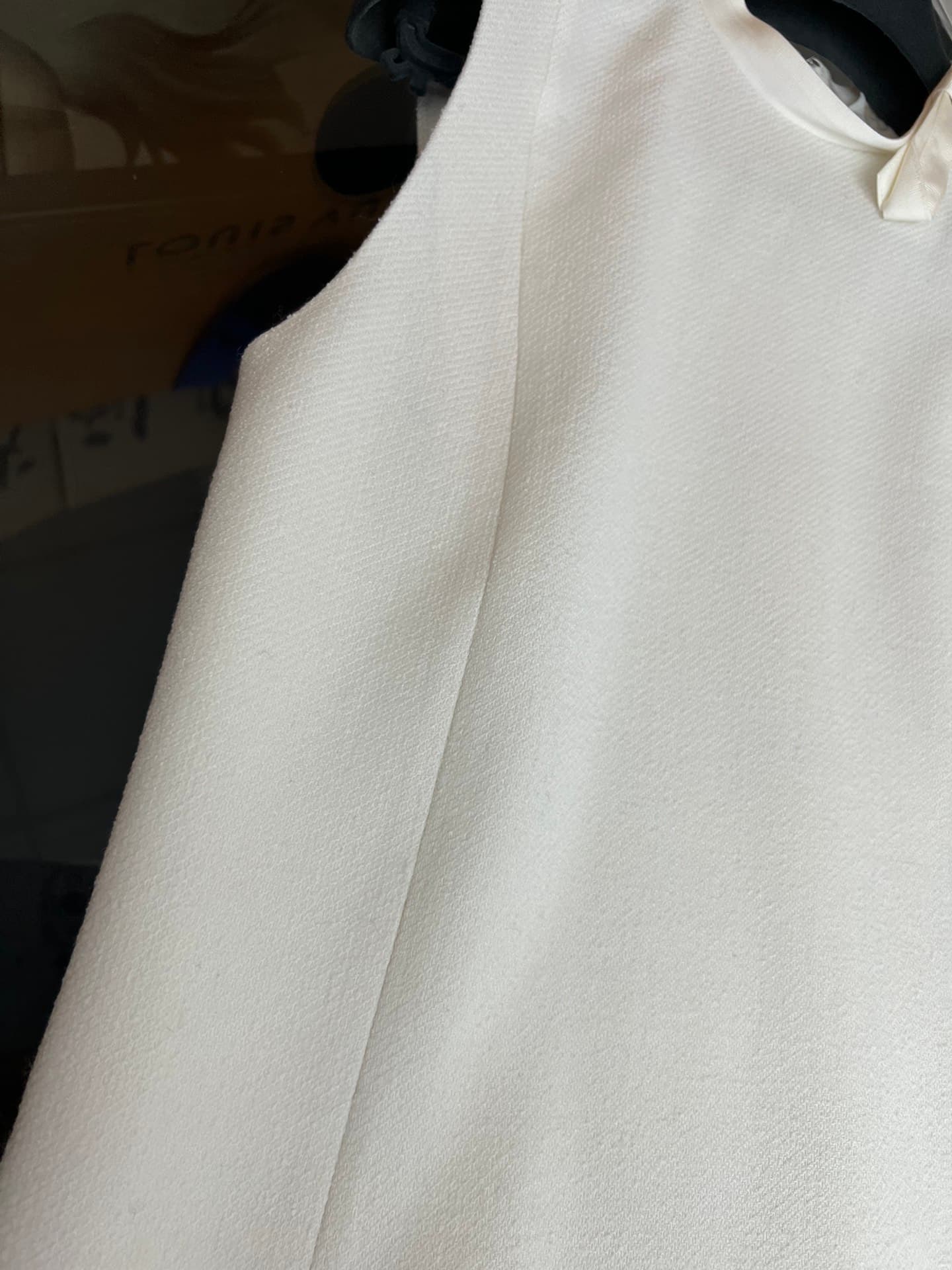 C18391 Image of the white dress laid flat — image 6