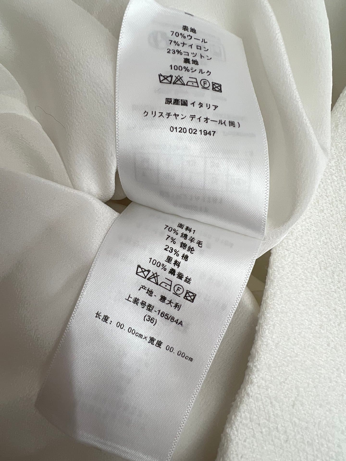 C18391 Image of the white dress laid flat — image 8
